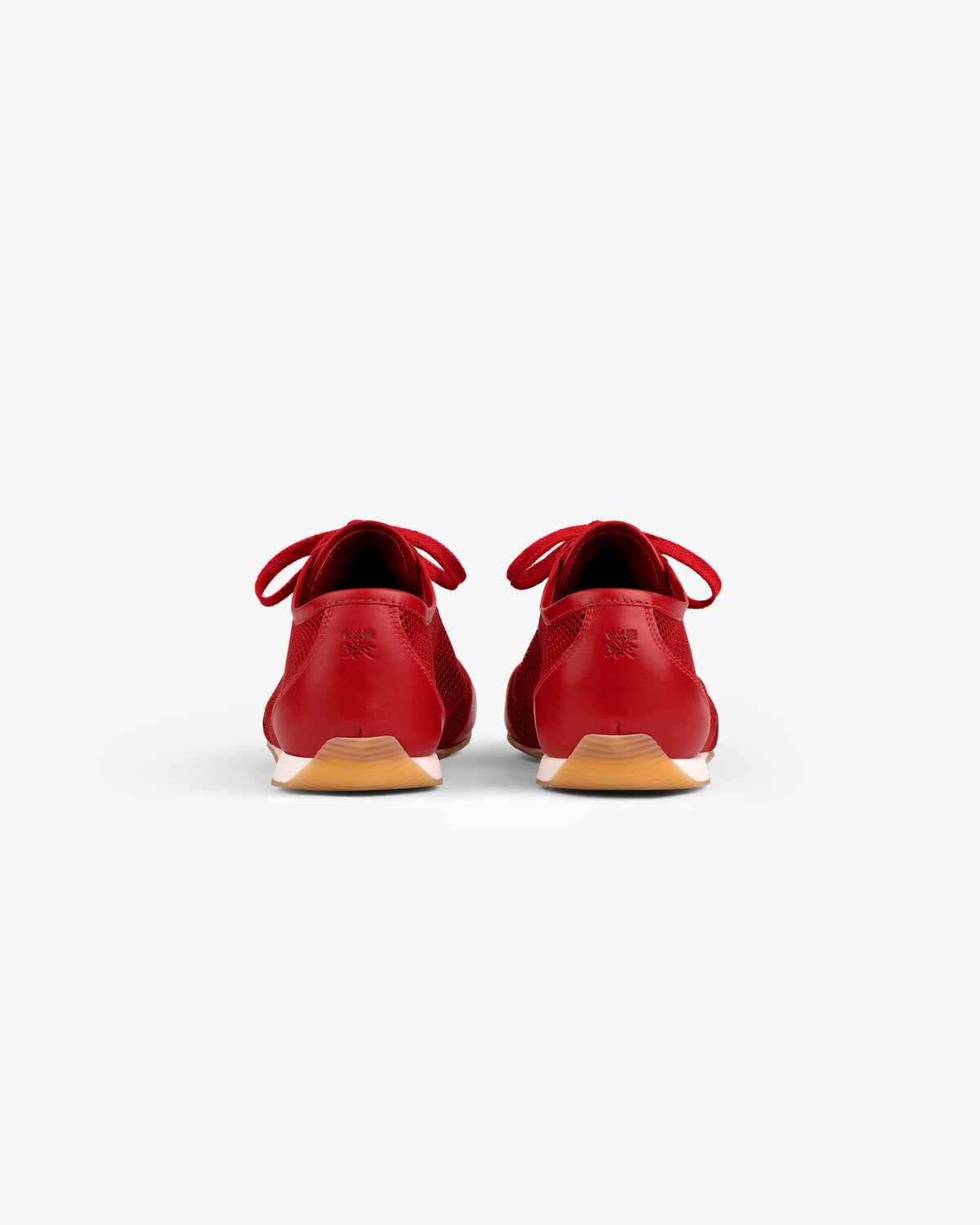 Back view of Low Profile Mesh Trainer in red with light brown soles and laces, set on a white background.