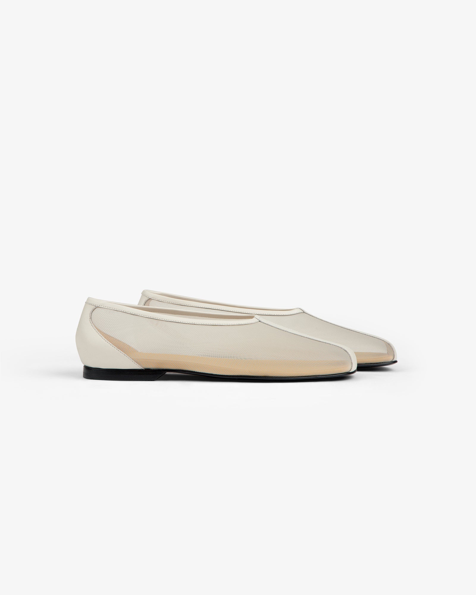 The Mesh Ballet Flat is a cream sheer slip-on with black soles, shown on a white background.