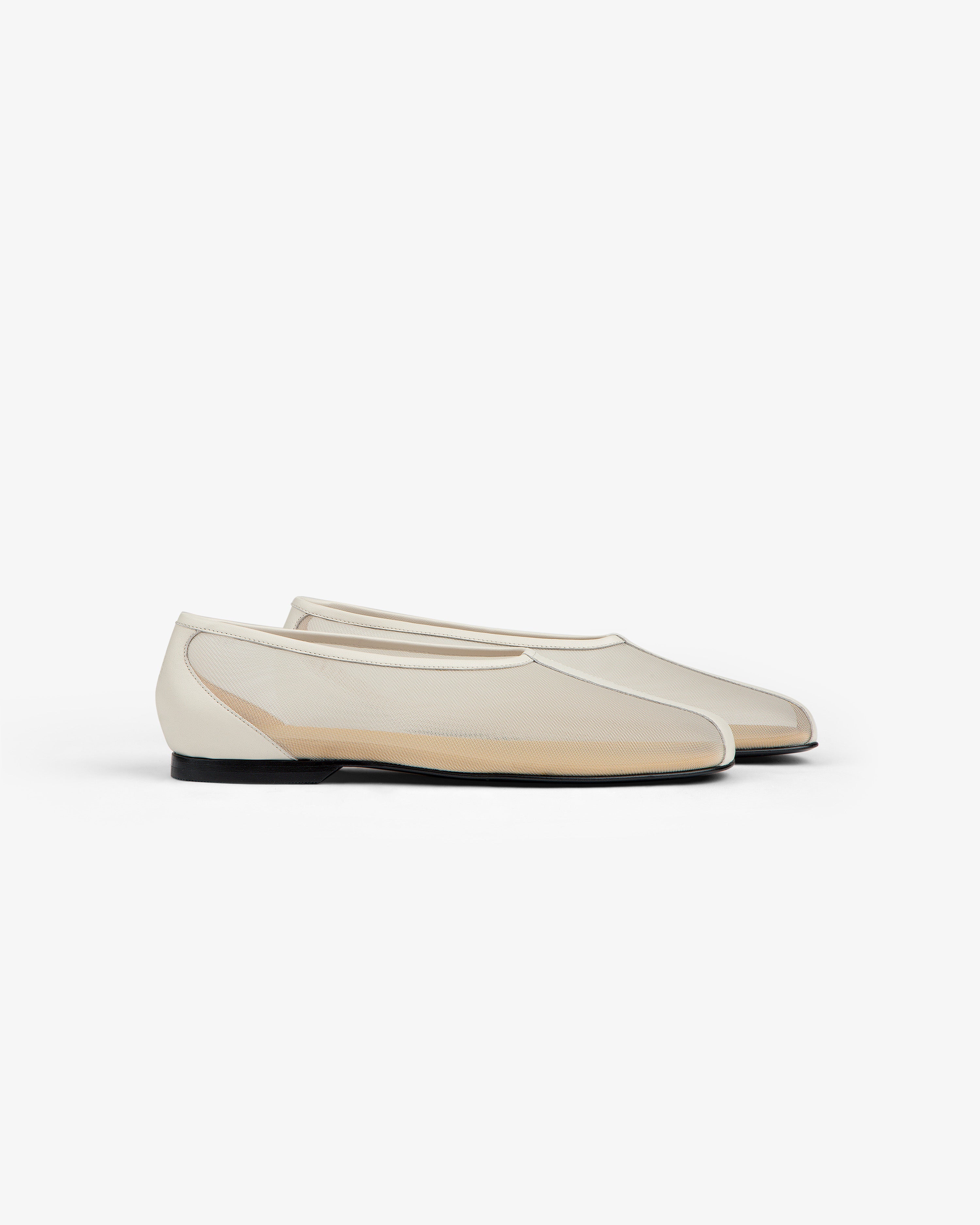 The Mesh Ballet Flat is a cream sheer slip-on with black soles, shown on a white background.