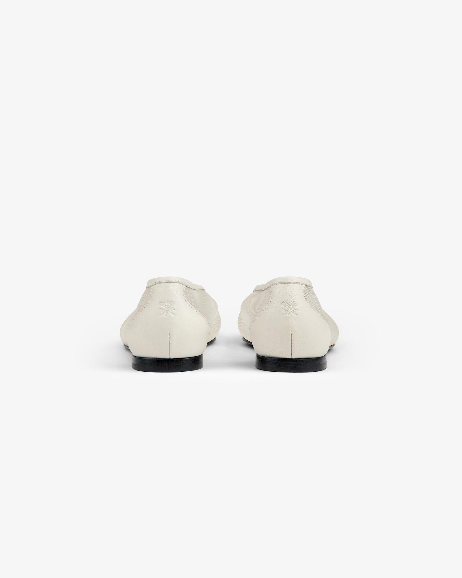A pair of Mesh Ballet Flats in white shown from the back on a plain white background.