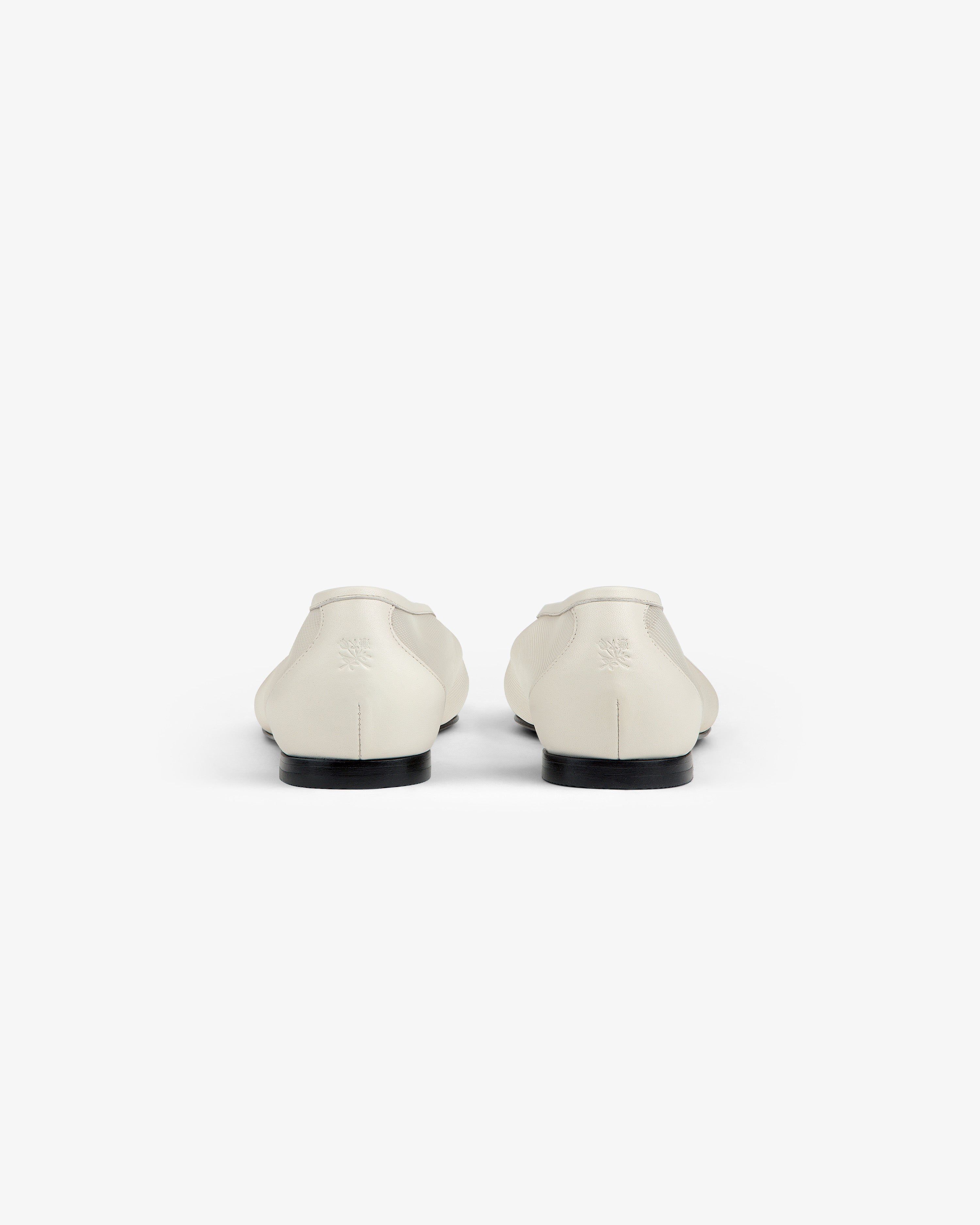 A pair of Mesh Ballet Flats in white shown from the back on a plain white background.