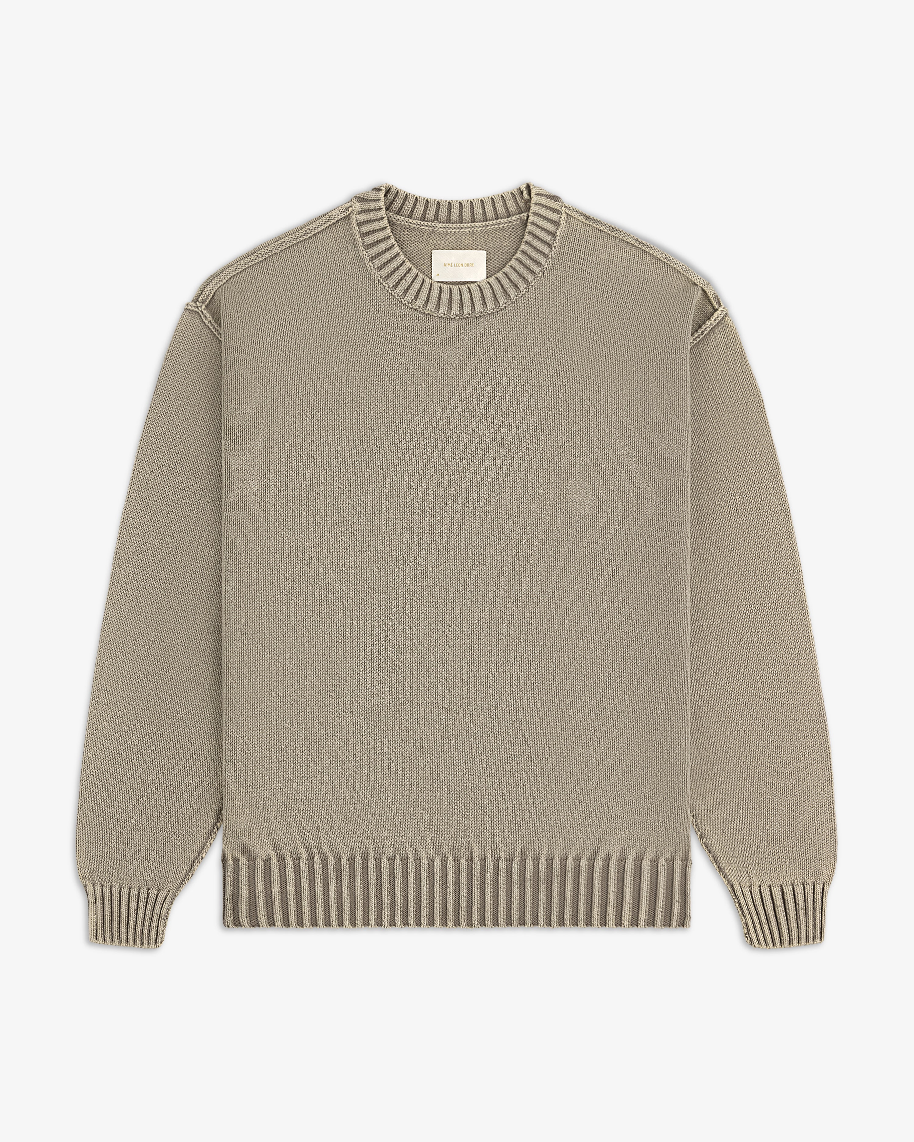 Washed Inside Out Sweater in beige, crewneck with ribbed cuffs, collar, and hem, shown flat on white background.