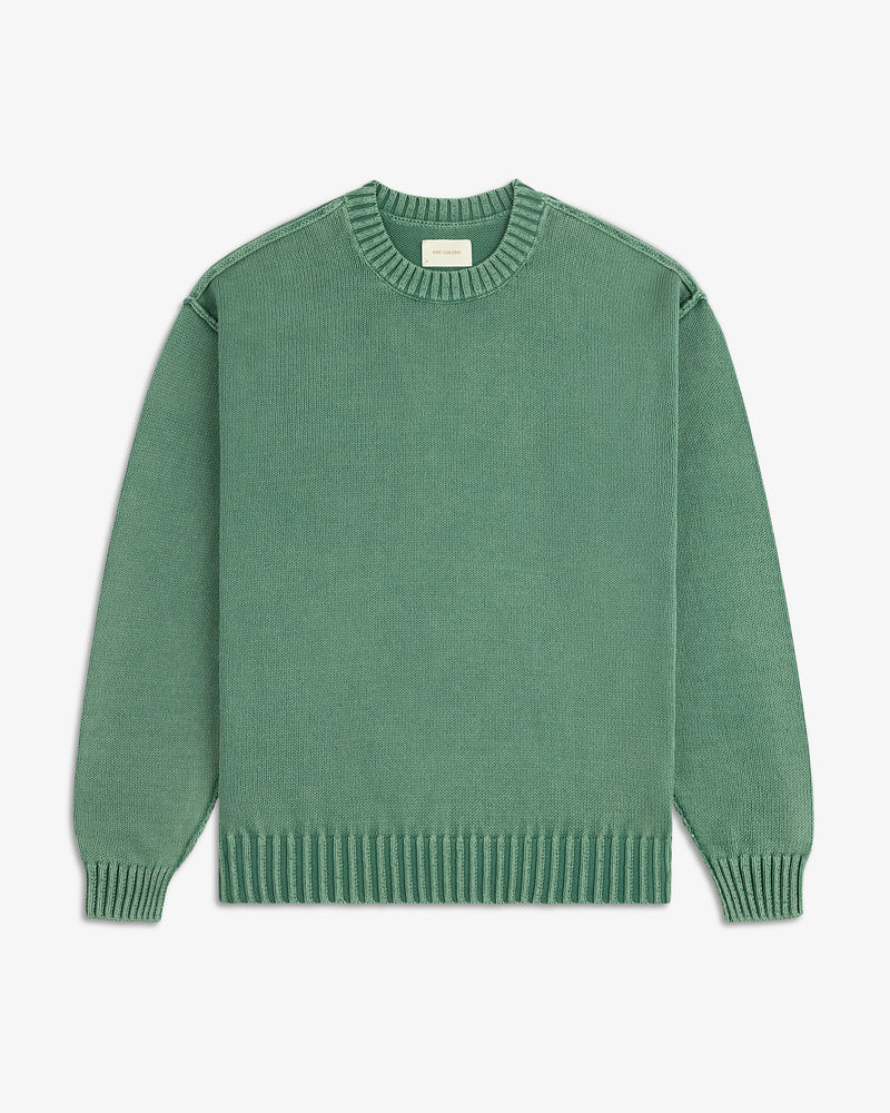 Washed Inside Out Sweater in green with ribbed cuffs, hem, and collar, laid flat on a white background.