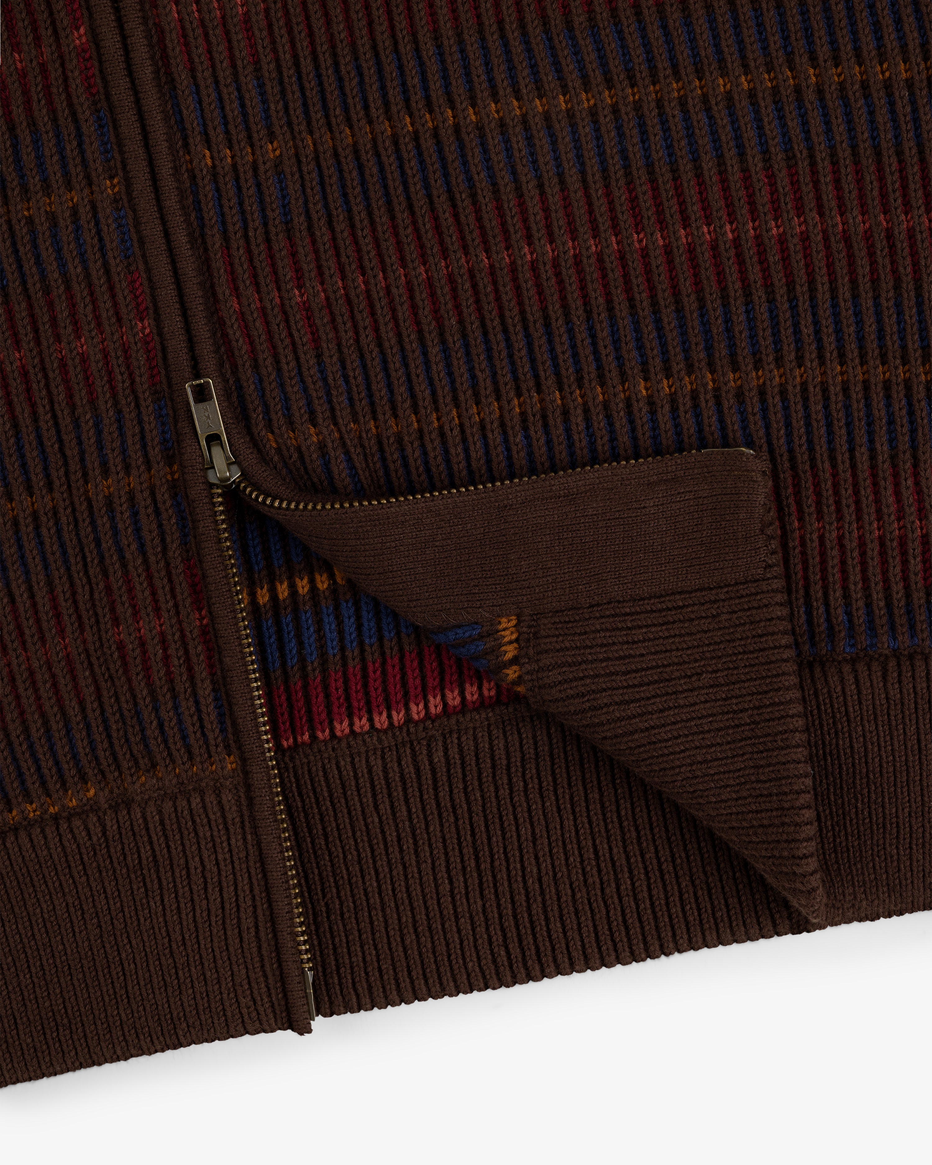 Multi Color Knit Track Sweater with brown zip-up design, ribbed hem, and blue, red, orange, and yellow stripes.