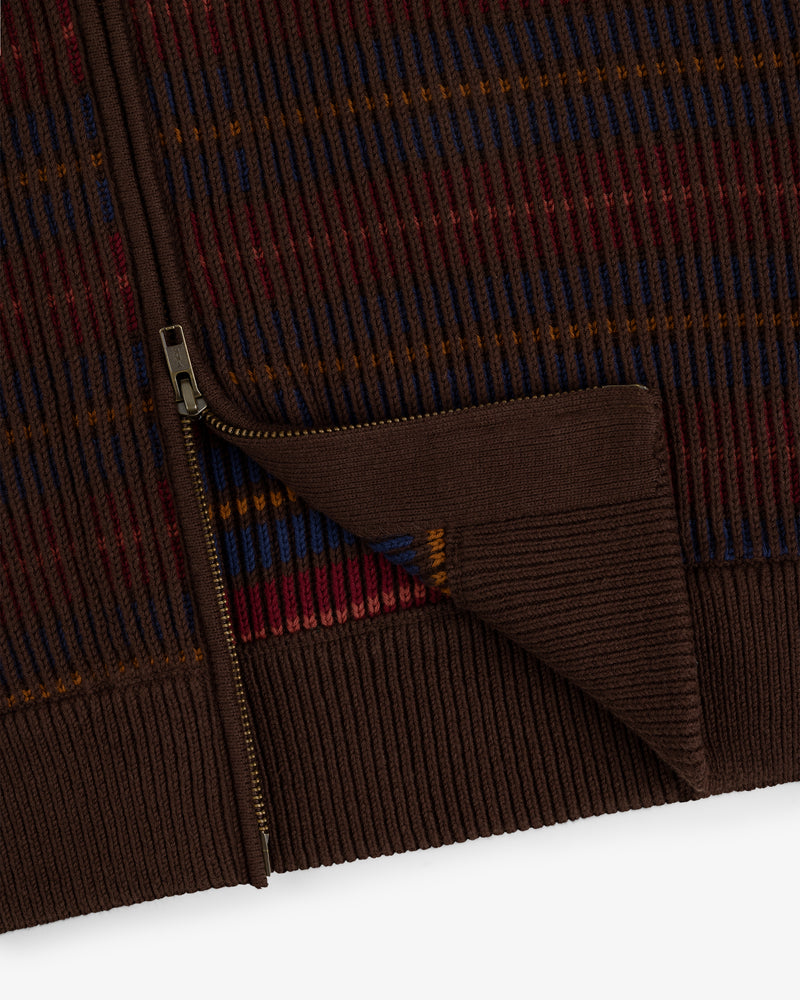 Multi Color Knit Track Sweater with brown zip-up design, ribbed hem, and blue, red, orange, and yellow stripes.