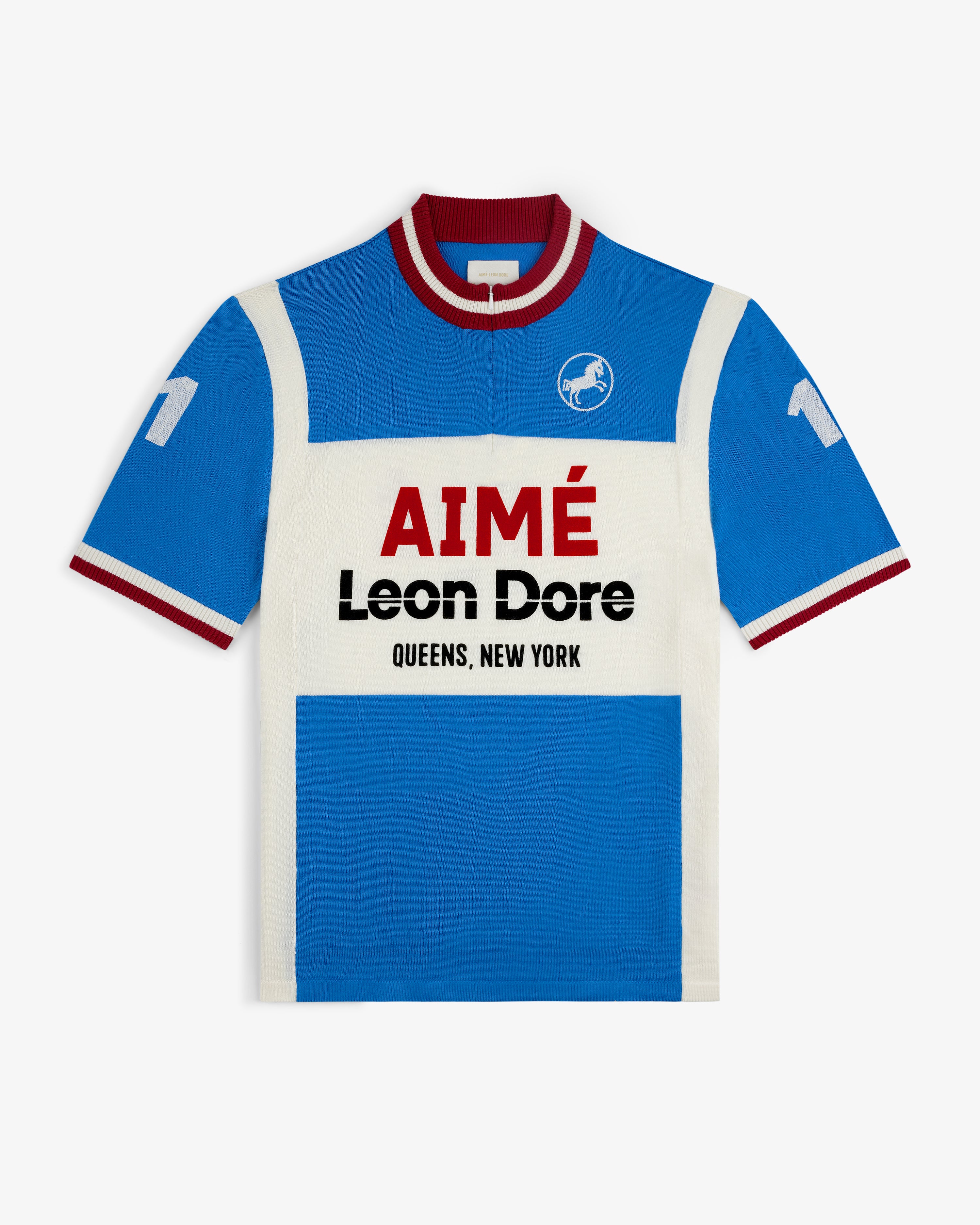 Blue and white Merino Wool Cycling Jersey with “AIMÉ Leon Dore QUEENS, NEW YORK” and number 11 on the sleeves.