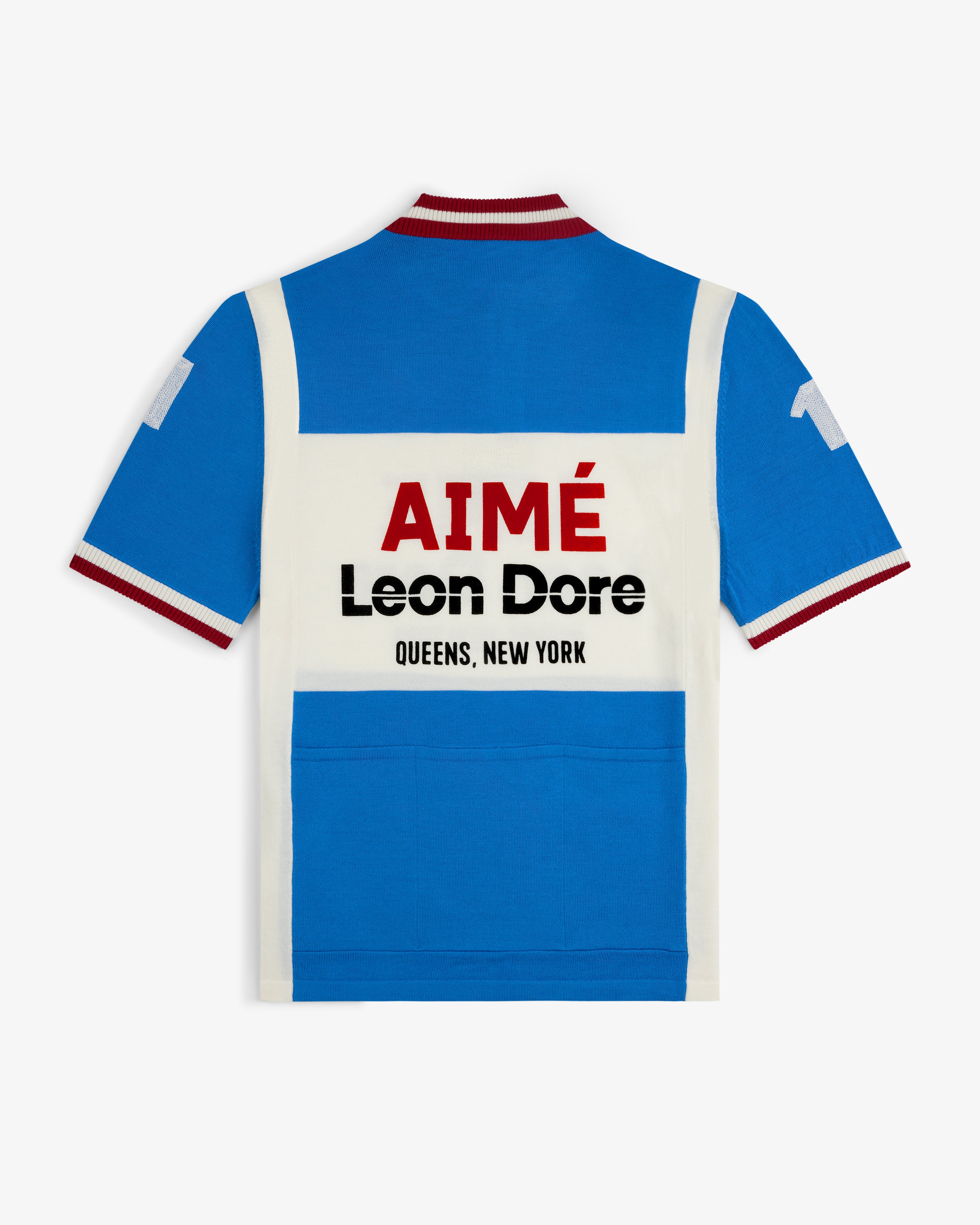 Blue and white Merino Wool Cycling Jersey with red collar trim, AIMÉ Leon Dore QUEENS, NEW YORK bold on the back.