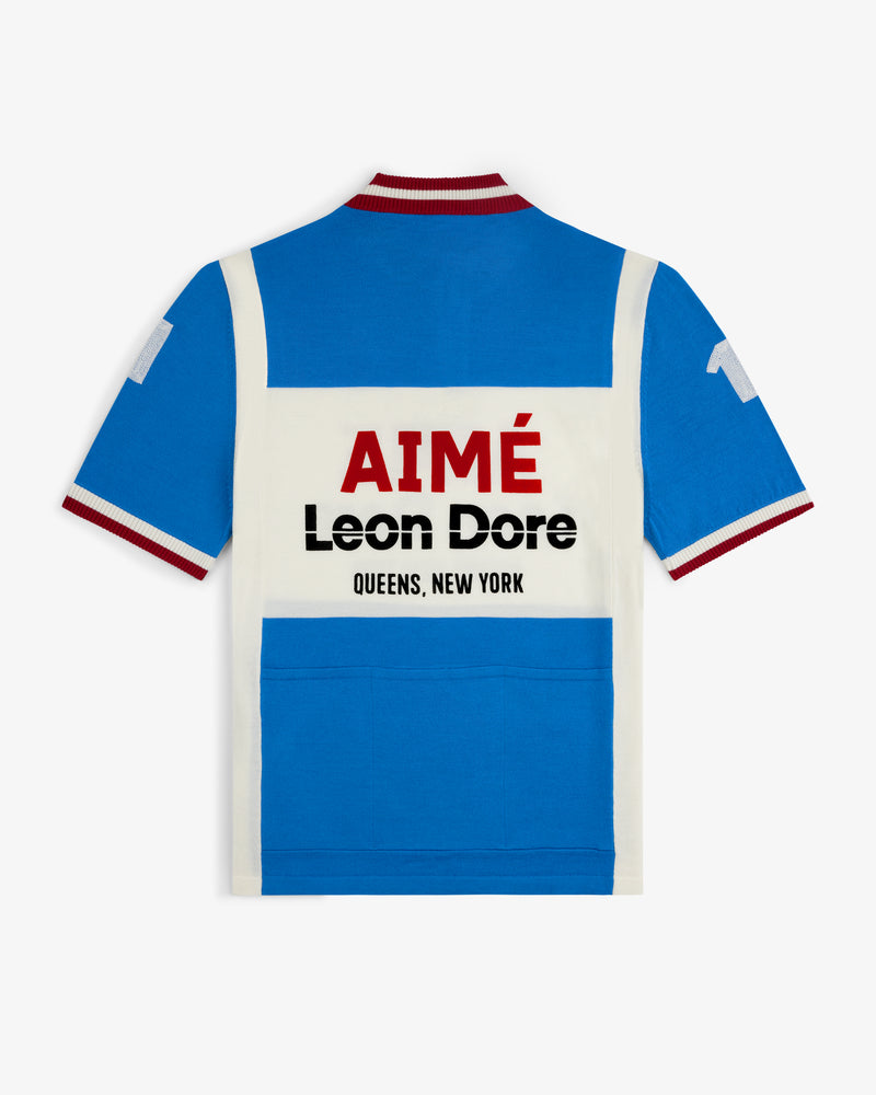 Blue and white Merino Wool Cycling Jersey with red collar trim, AIMÉ Leon Dore QUEENS, NEW YORK bold on the back.
