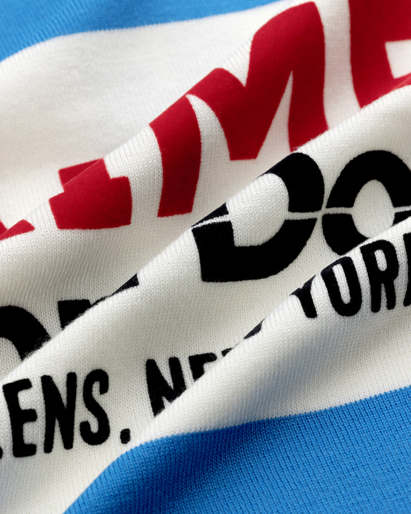 Close-up of Merino Wool Cycling Jersey with red and black NEW YORK text on white and blue striped fabric.