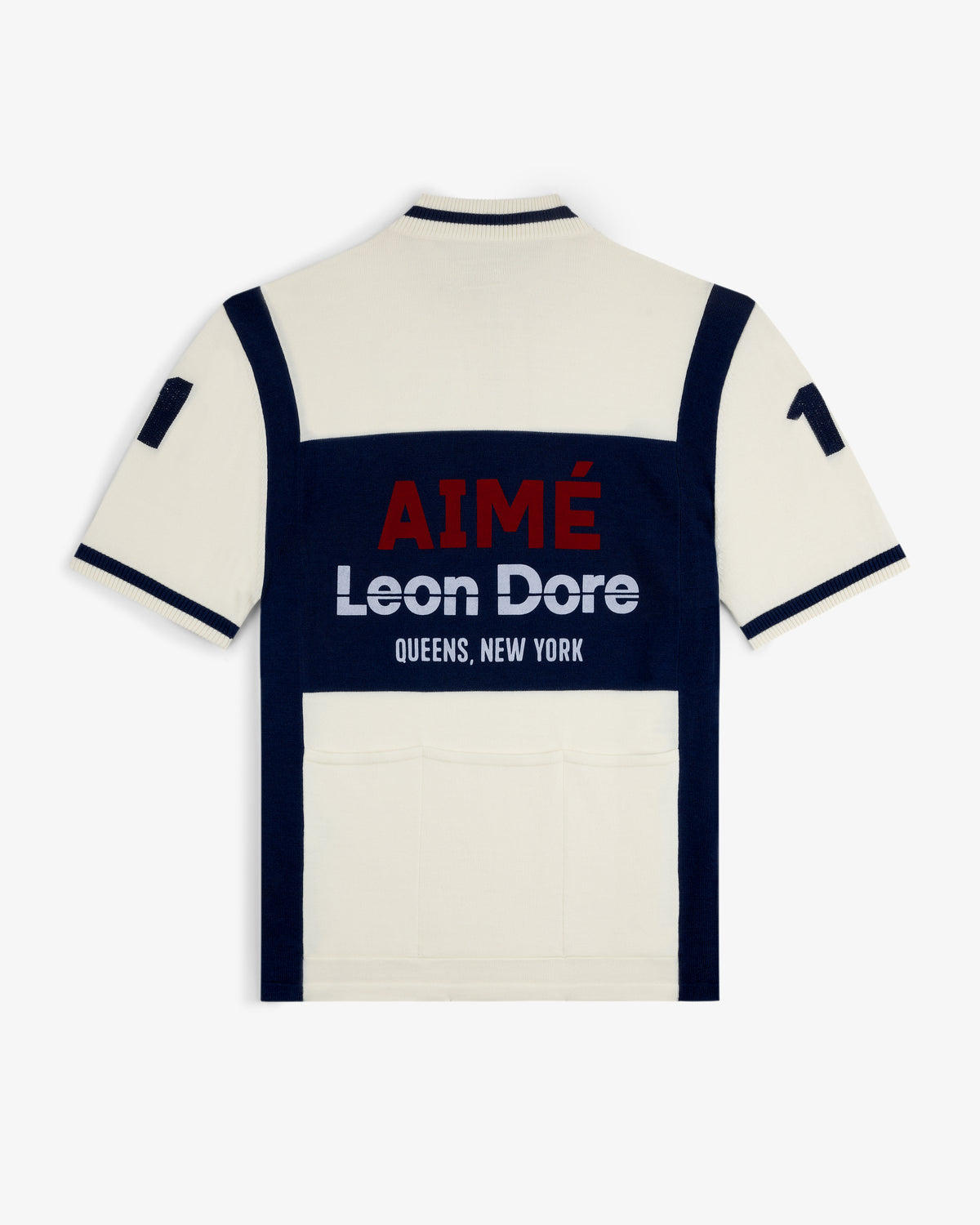 Merino Wool Cycling Jersey in cream/navy with “AIMÉ Leon Dore QUEENS, NEW YORK” text on the back.