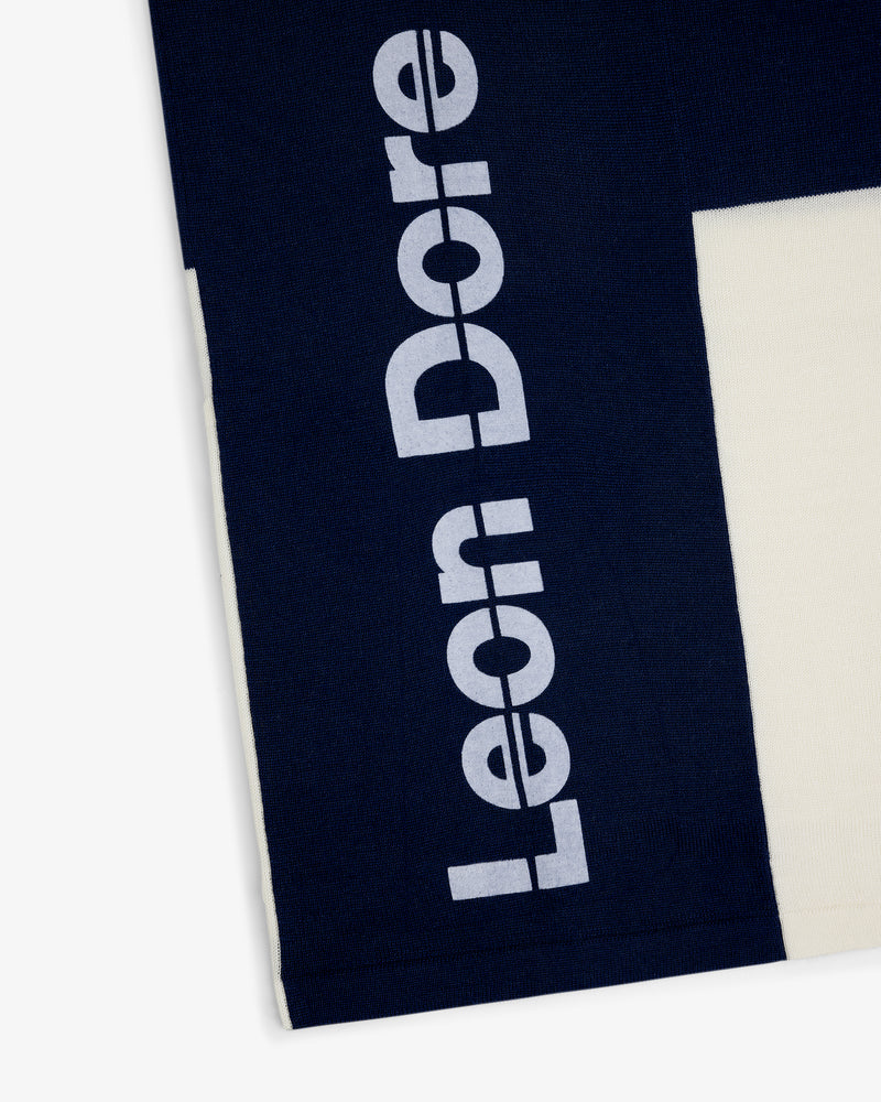 Navy Merino Wool Cycling Jersey with Leon Dore printed vertically in large white letters on the side.