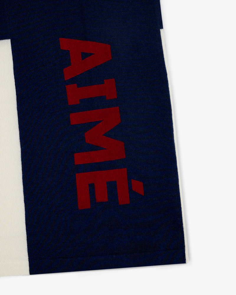 Navy blue and white Merino Wool Cycling Jersey with AIMÉ in bold red letters printed vertically.