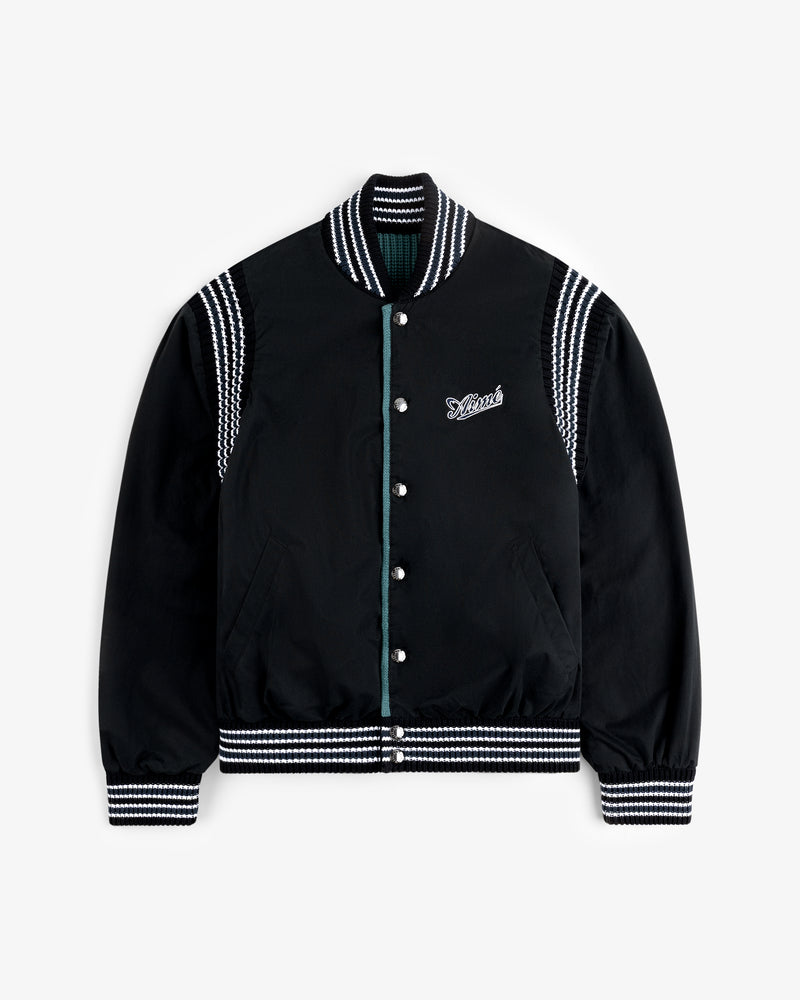 Reversible Knit Bomber Jacket with black body, white striped trim, and embroidered logo on the left chest.
