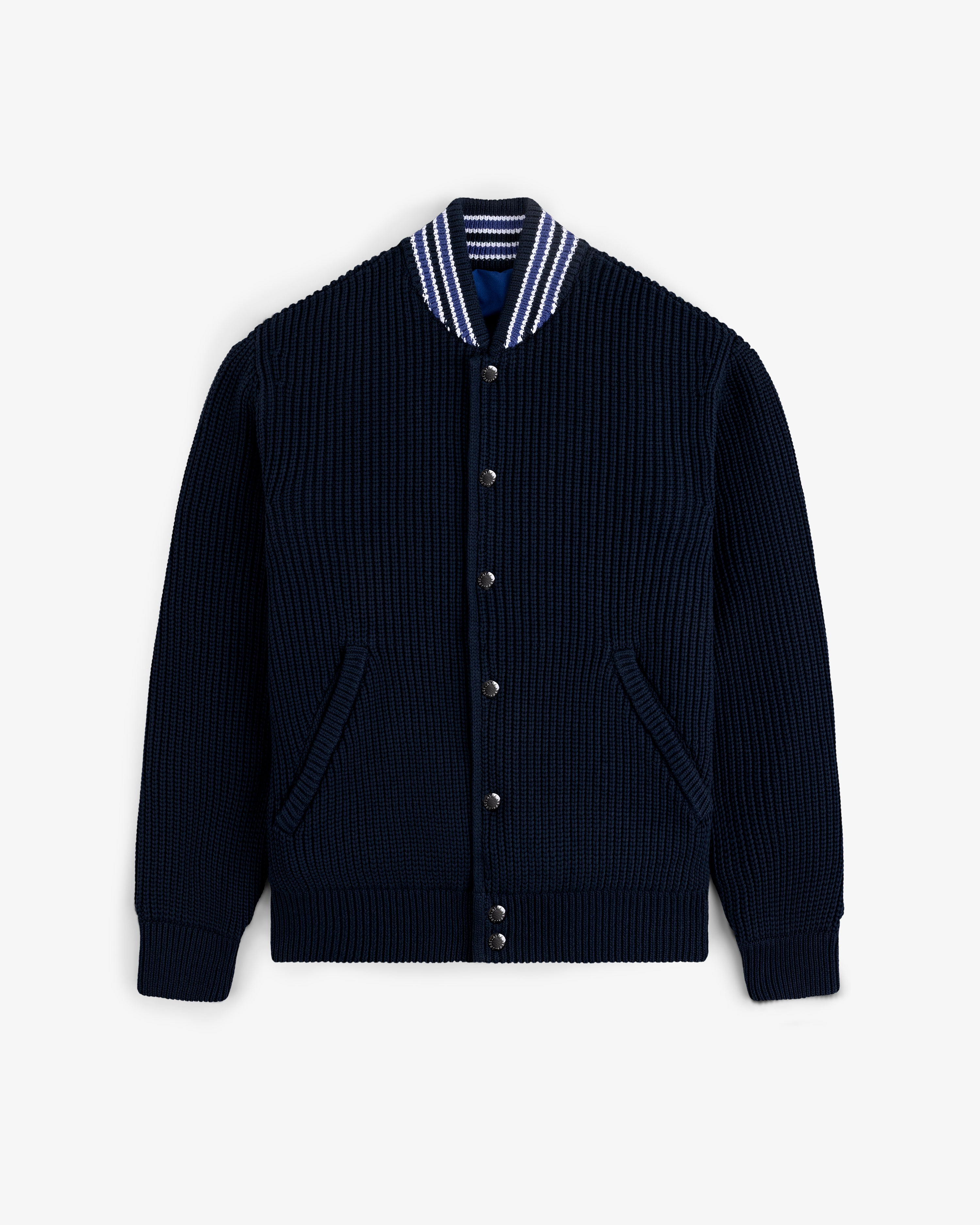 Reversible Knit Bomber Jacket in navy blue with striped collar, button front, and two pockets displayed on white background.