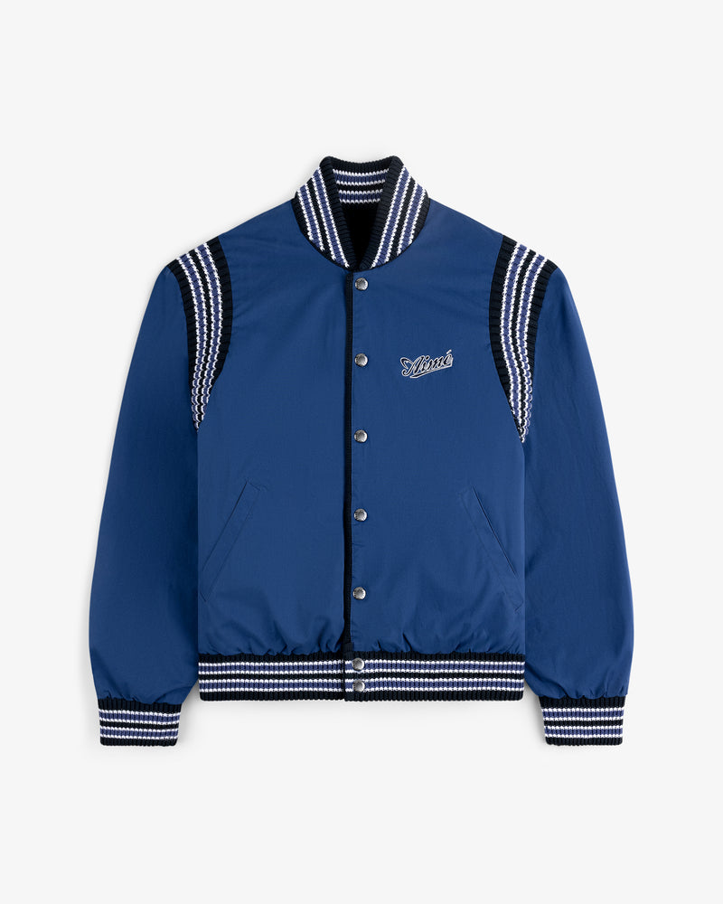 Reversible Knit Bomber Jacket in blue with striped ribbed trim and "Lover" embroidered on the chest.