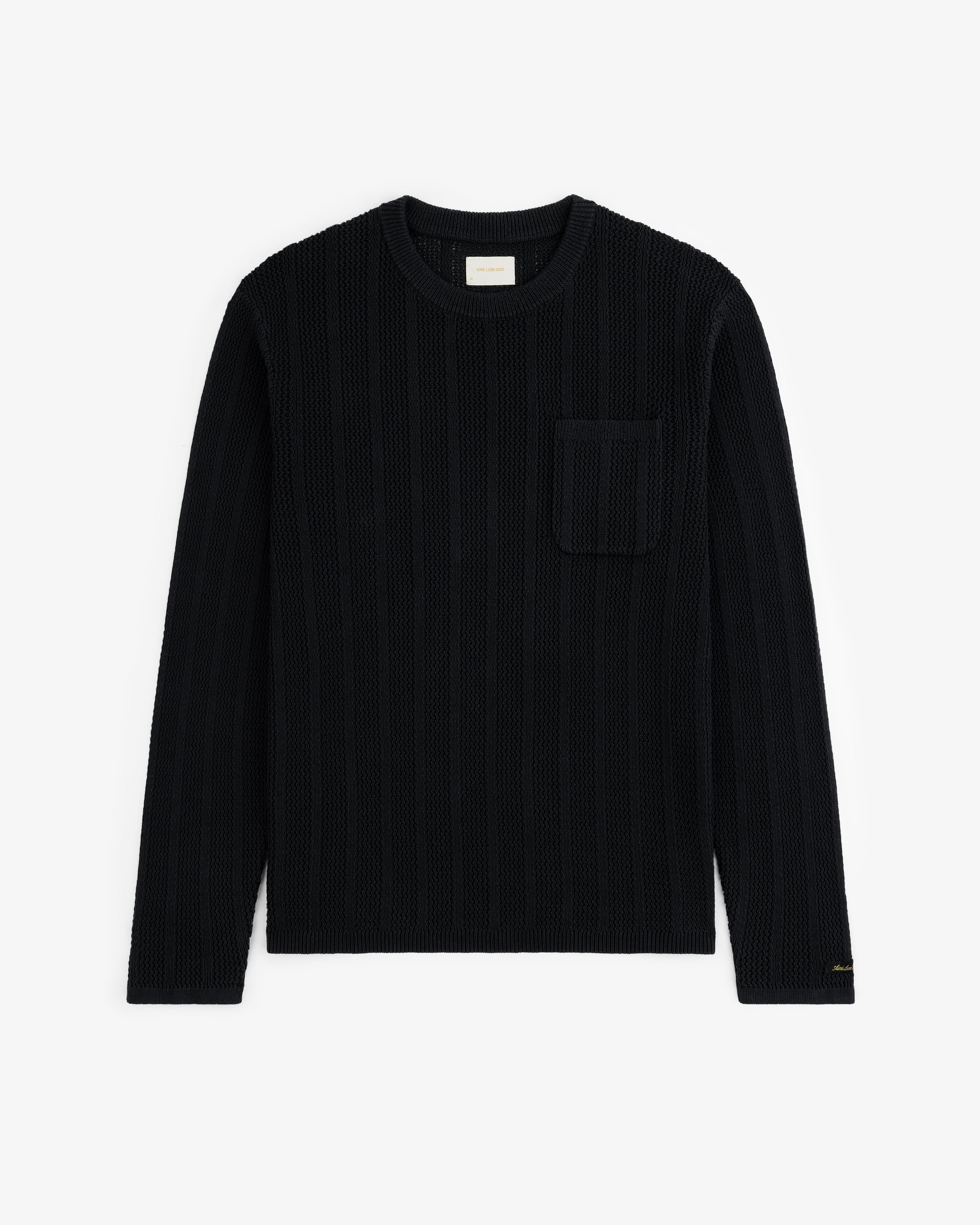 Black Racking Stitch Crewneck Sweater with long sleeves and chest pocket, shown flat on a white background.