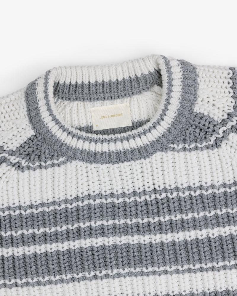 Striped Crewneck Sweater in white and gray with a ribbed neck and woven label inside the collar.