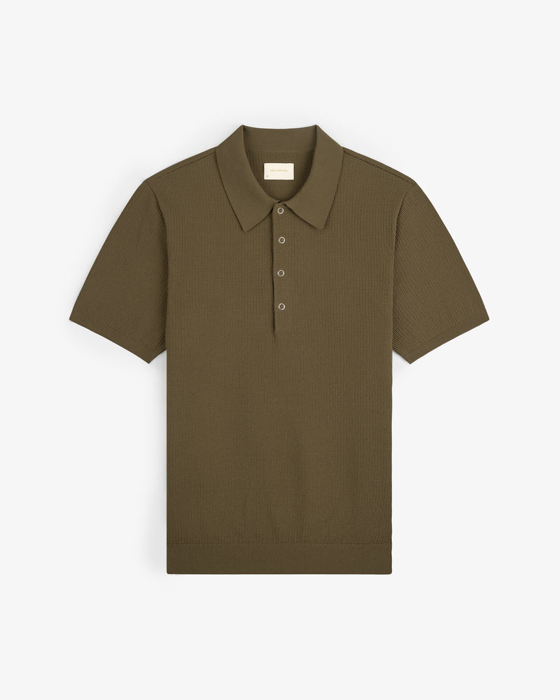 Olive green Knit Polo with short sleeves, collar, and three buttons shown laid flat on a white background.