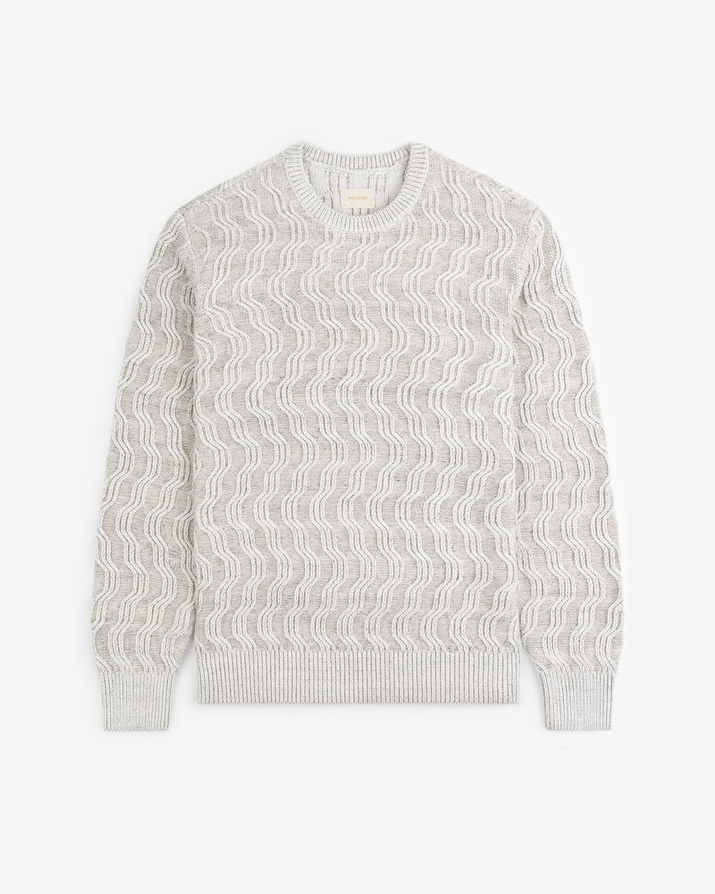 Linen Blend Cable Knit Sweater in beige, featuring a wavy texture, laid flat on a white background.