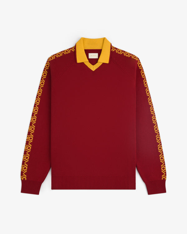 The Knit Sport Pullover is a red long-sleeve sweater with a yellow collar and patterned yellow sleeve designs.