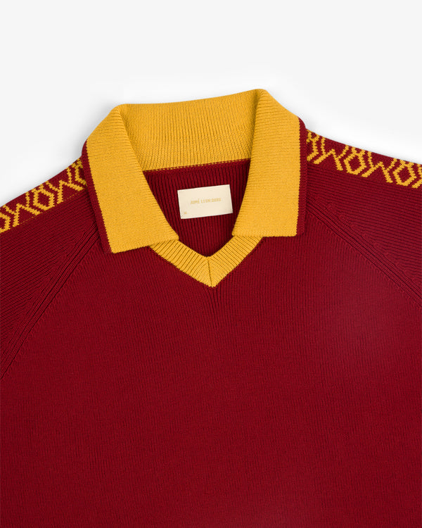 Knit Sport Pullover in maroon with yellow collar and geometric shoulder patterns.
