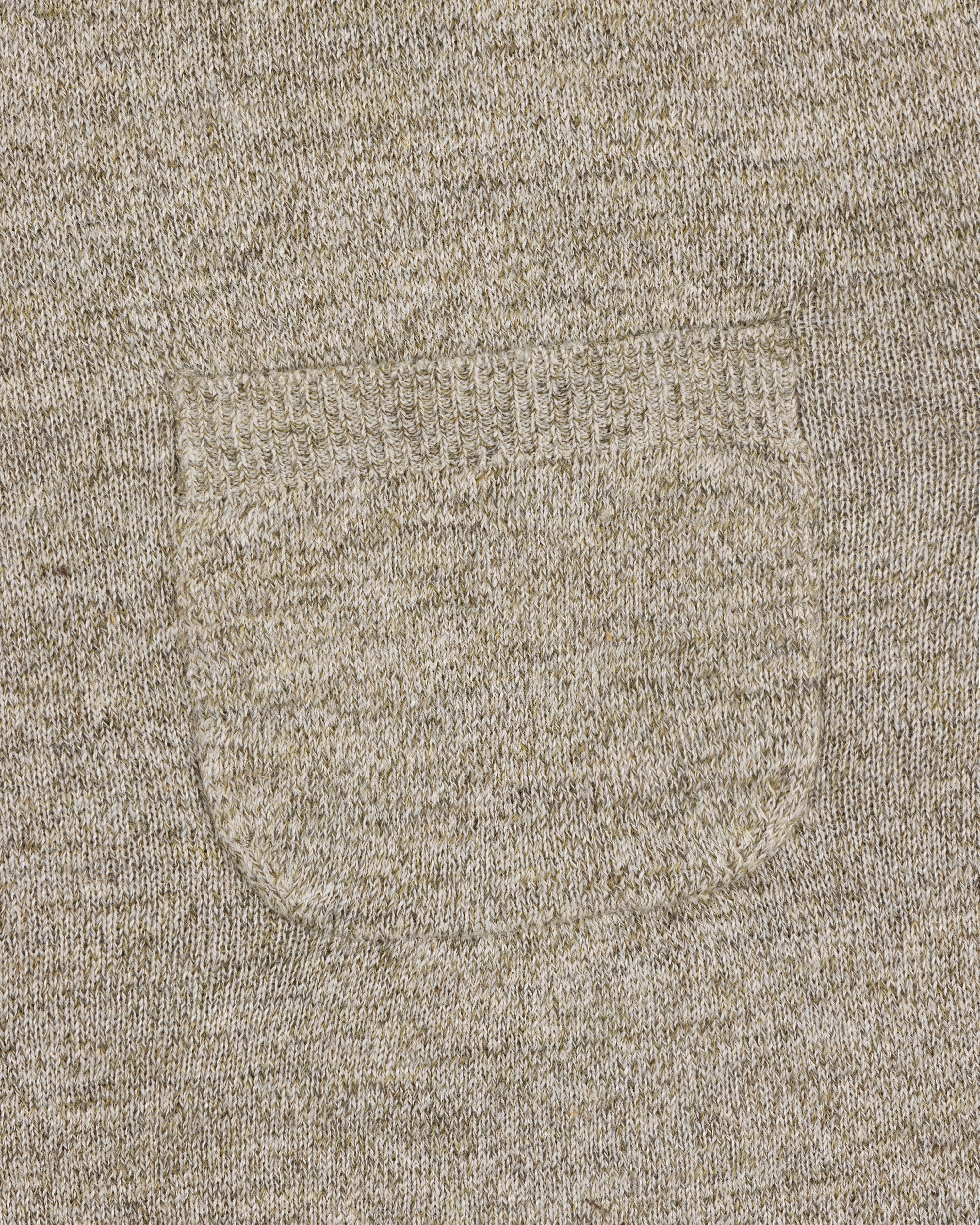Close-up of the Long-Sleeve Knit Pocket Tee in beige, featuring a small textured patch pocket on the front.