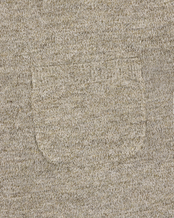 Close-up of the Long-Sleeve Knit Pocket Tee in beige, featuring a small textured patch pocket on the front.