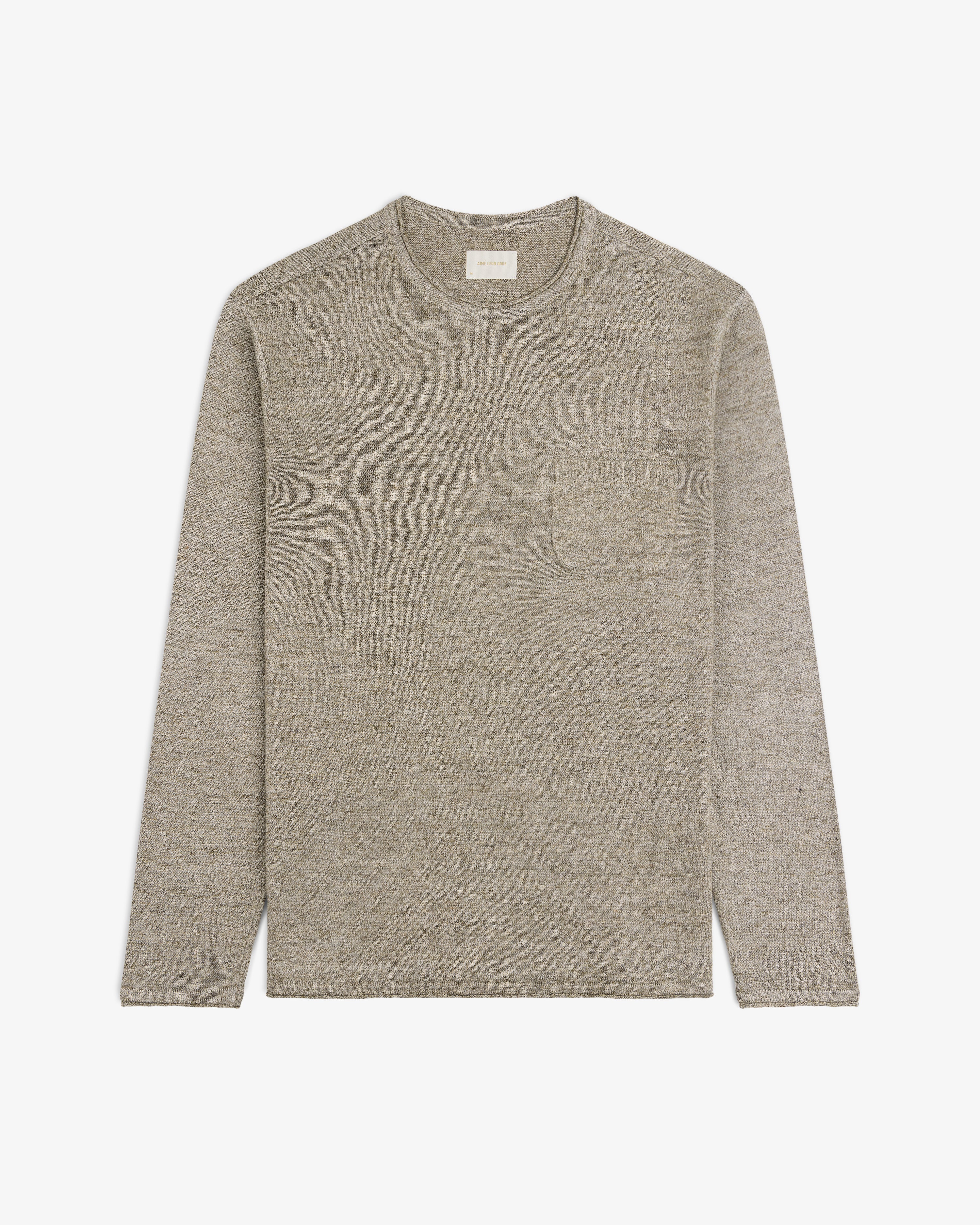 The Long-Sleeve Knit Pocket Tee in beige with a chest pocket, laid flat on a white background.