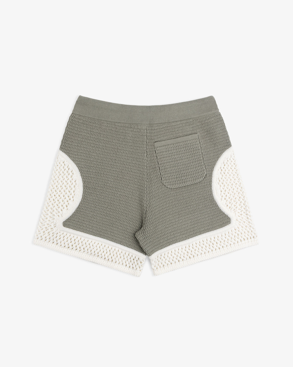 Knit Court Short in green with white crochet trim and a back pocket, shown on a white background.