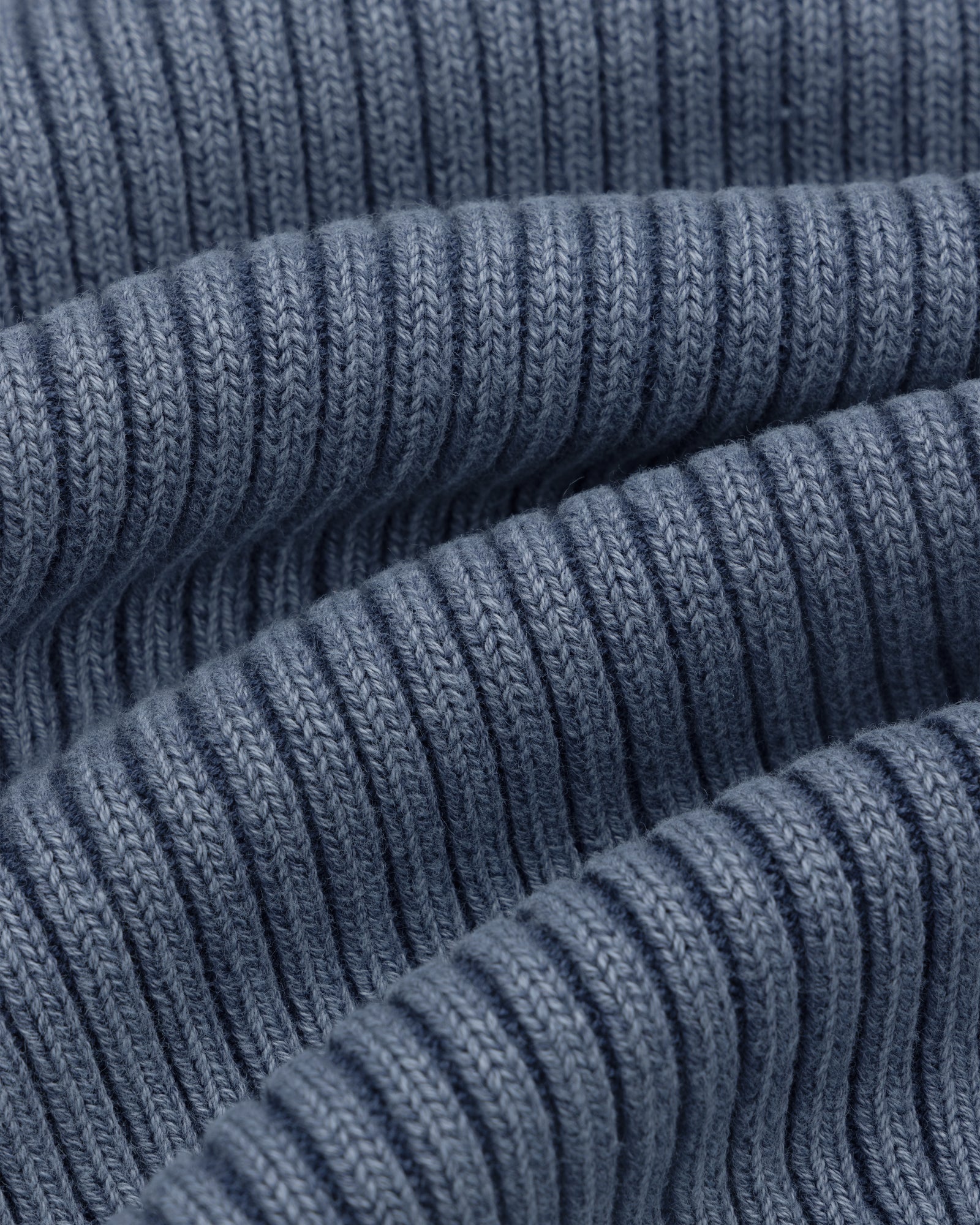 Close-up of the Stone Washed Knit Tank Top in blue, showcasing its soft, ribbed knit texture.