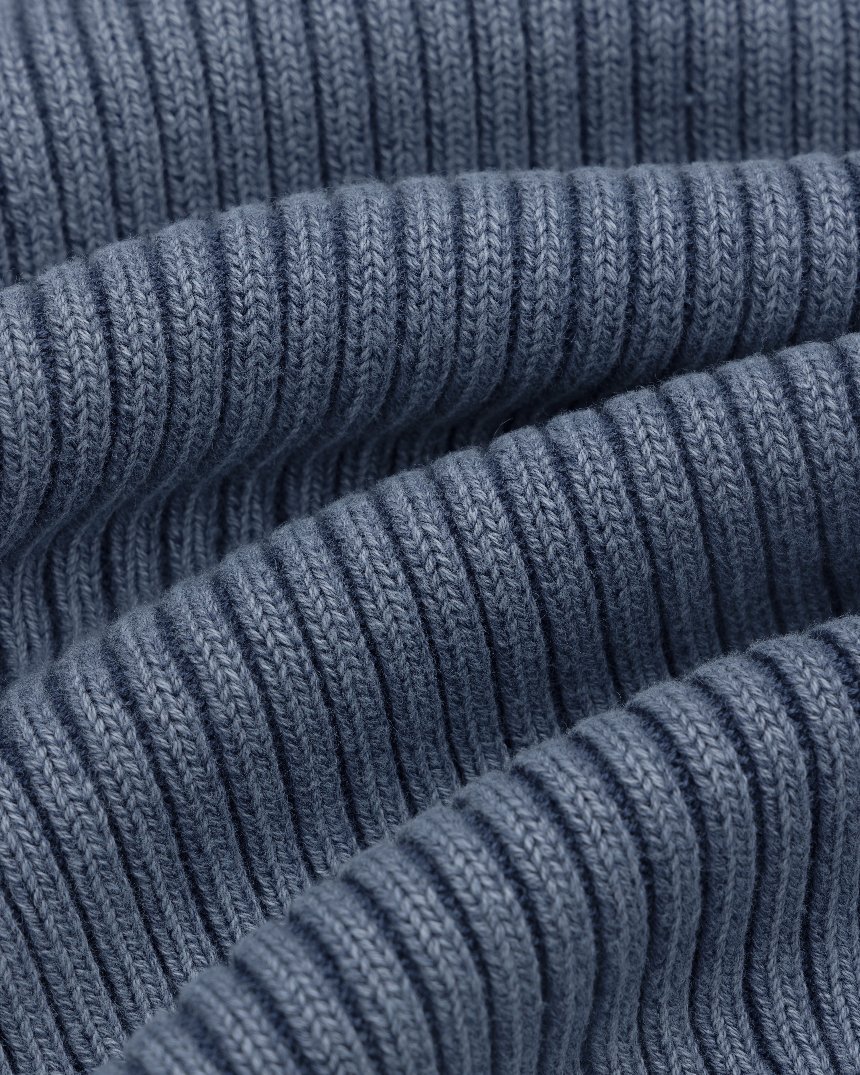 Close-up of the Stone Washed Knit Tank Top in blue, showcasing its soft, ribbed knit texture.