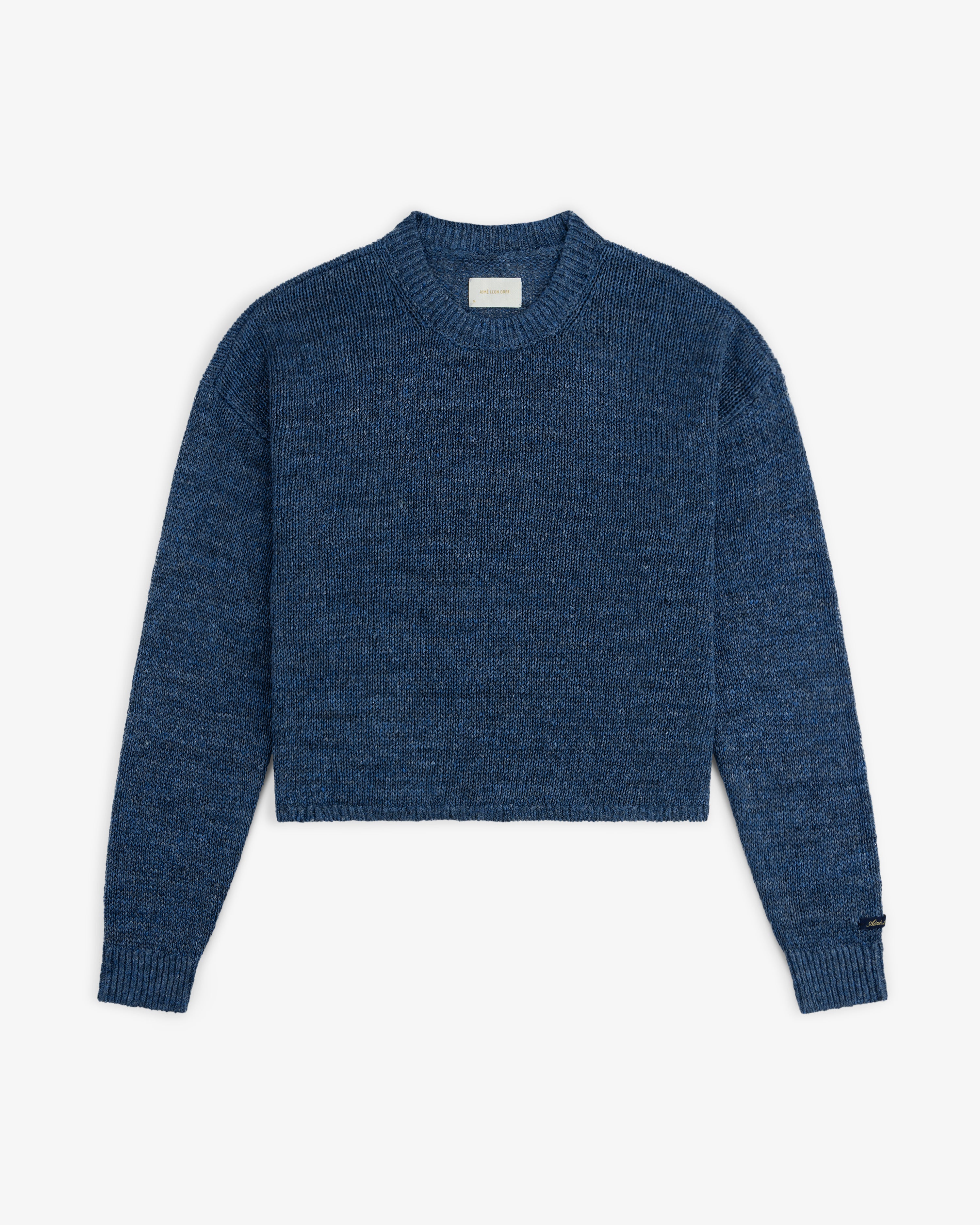 Linen Knit Crewneck Sweater in blue with long sleeves and ribbed cuffs, shown flat on a white background.