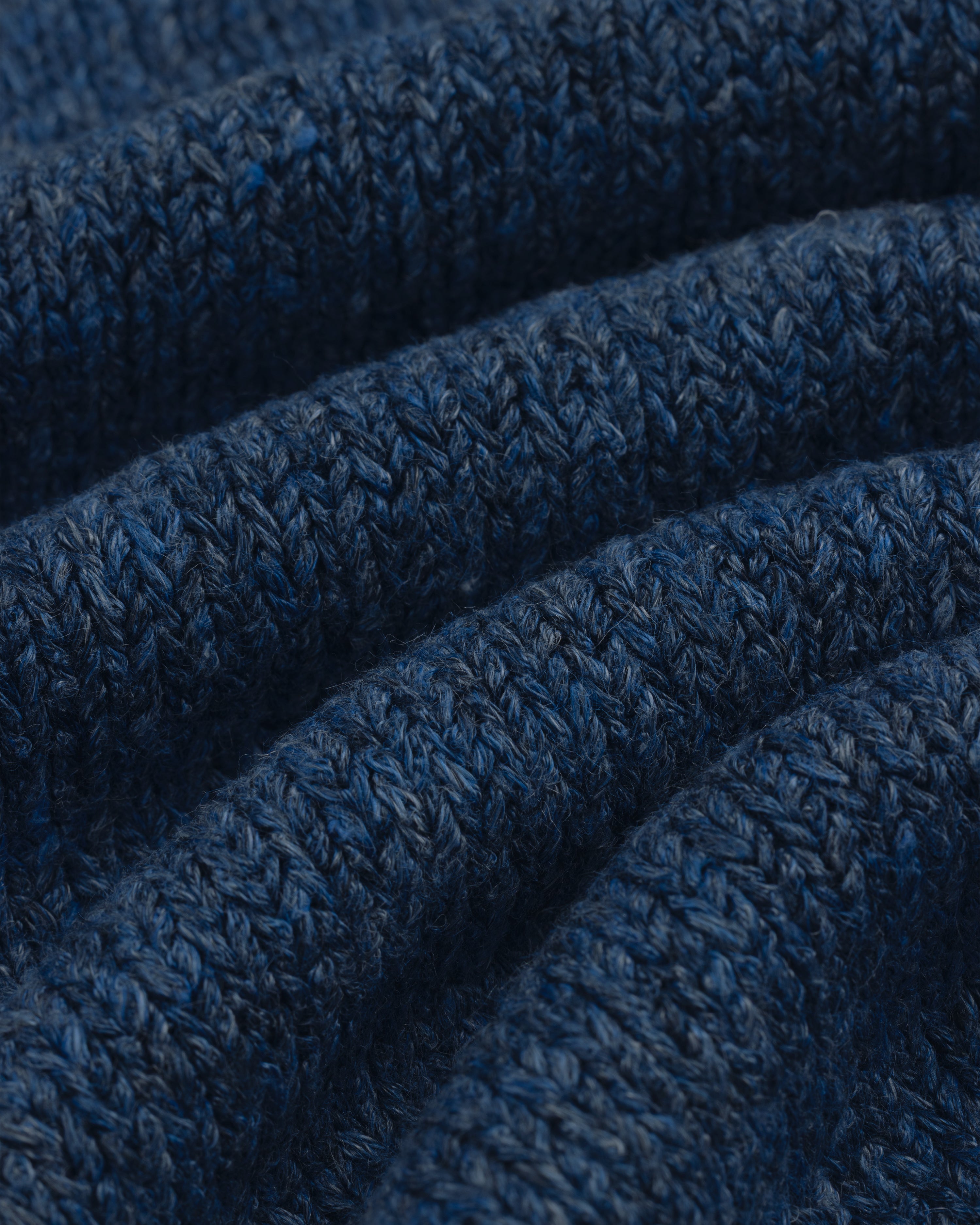 Close-up of Linen Knit Drawstring Short in blue, showing textured stitches and gentle fabric folds.