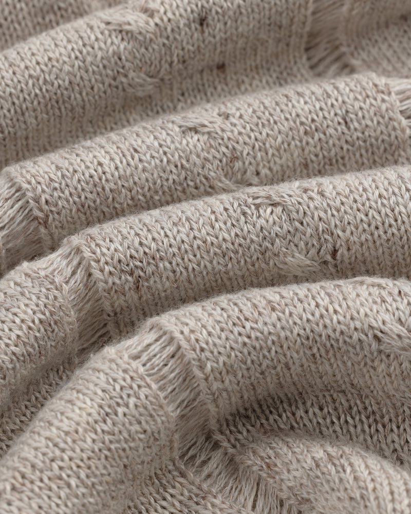 Close-up of the Pointelle Tank Top's textured beige knit fabric with visible fibers and a soft, cozy look.