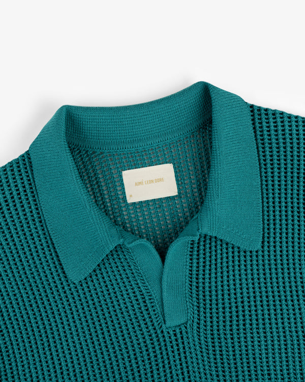Teal Mesh Knit Polo with a textured pattern and a beige label inside the neckline.