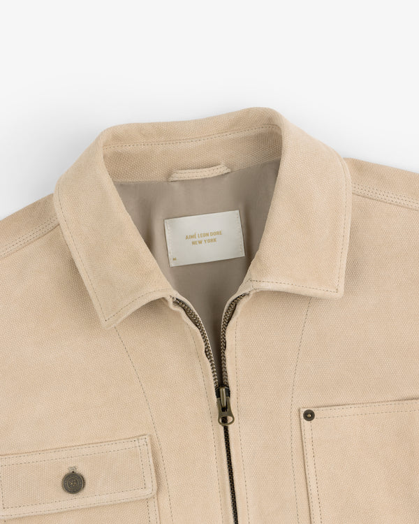 Beige Leather Ranch Jacket with zip front, chest pockets, and AIMÉ LEON DORE NEW YORK label.