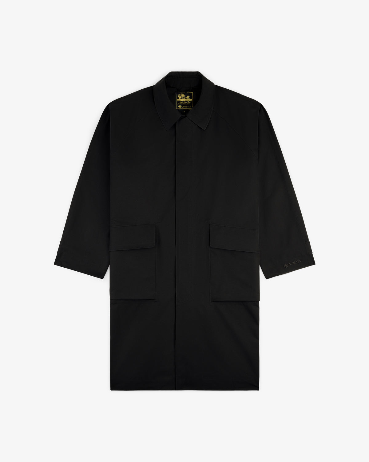 Black GORE-TEX Balmacaan Coat with long sleeves, collar, and two large front pockets, shown on a white background.