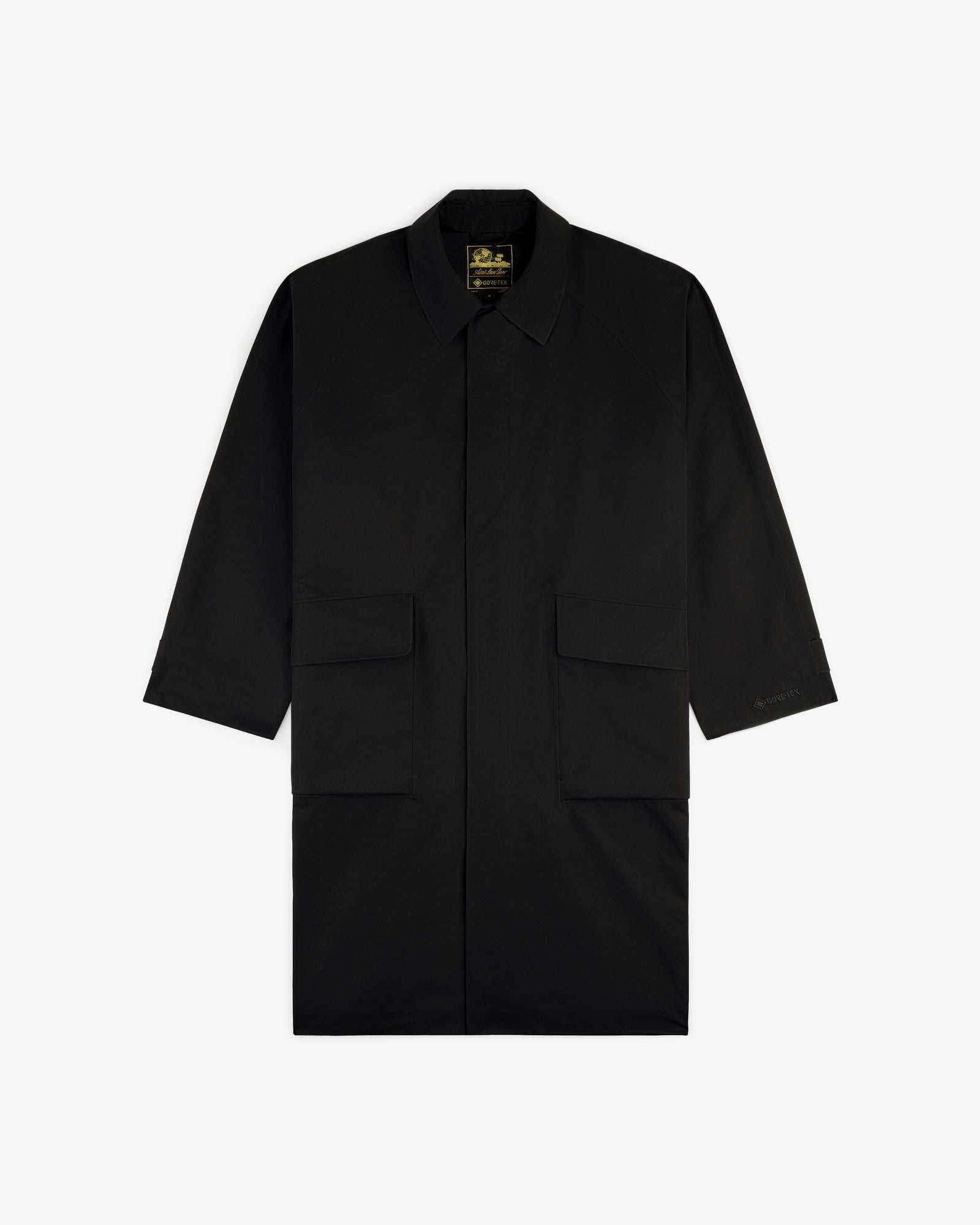 Black GORE-TEX Balmacaan Coat with long sleeves, collar, and two large front pockets, shown on a white background.