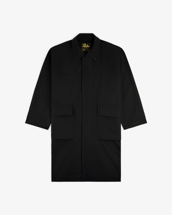 Black GORE-TEX Balmacaan Coat with long sleeves, collar, and two large front pockets, shown on a white background.