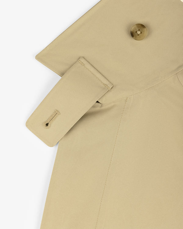 Close-up of GORE-TEX Balmacaan Coat shoulder with buttoned epaulette and visible stitching details.