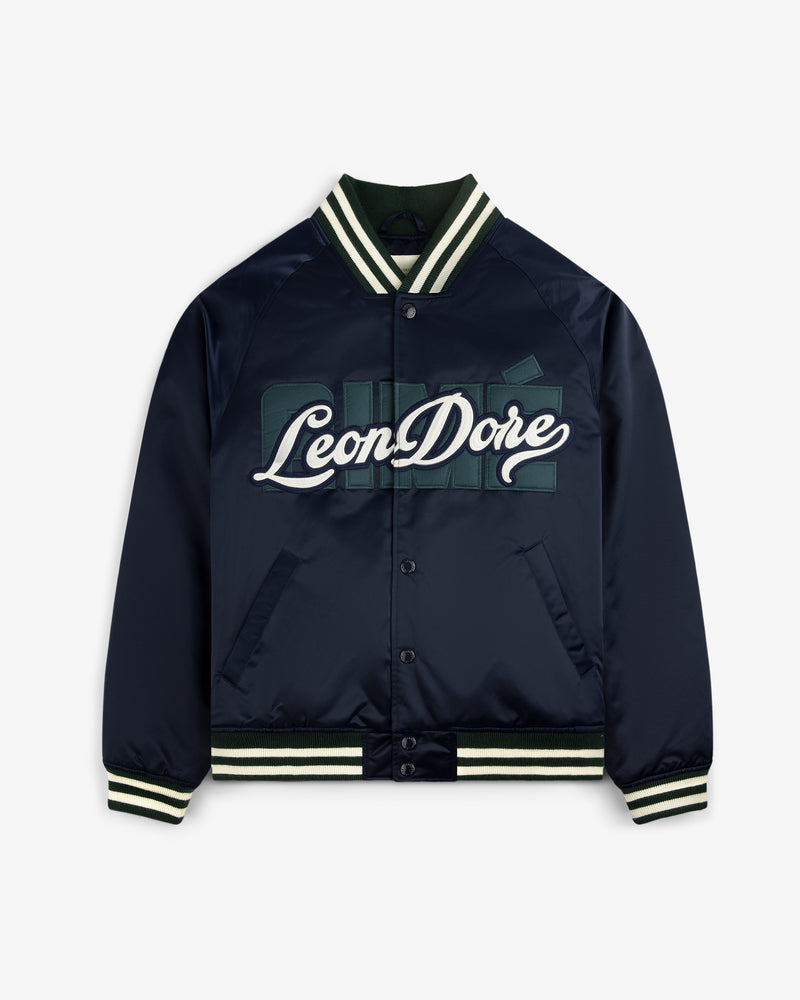 Overlay Logo Satin Varsity Jacket in navy with white and green text, striped trim, and snap button closure.