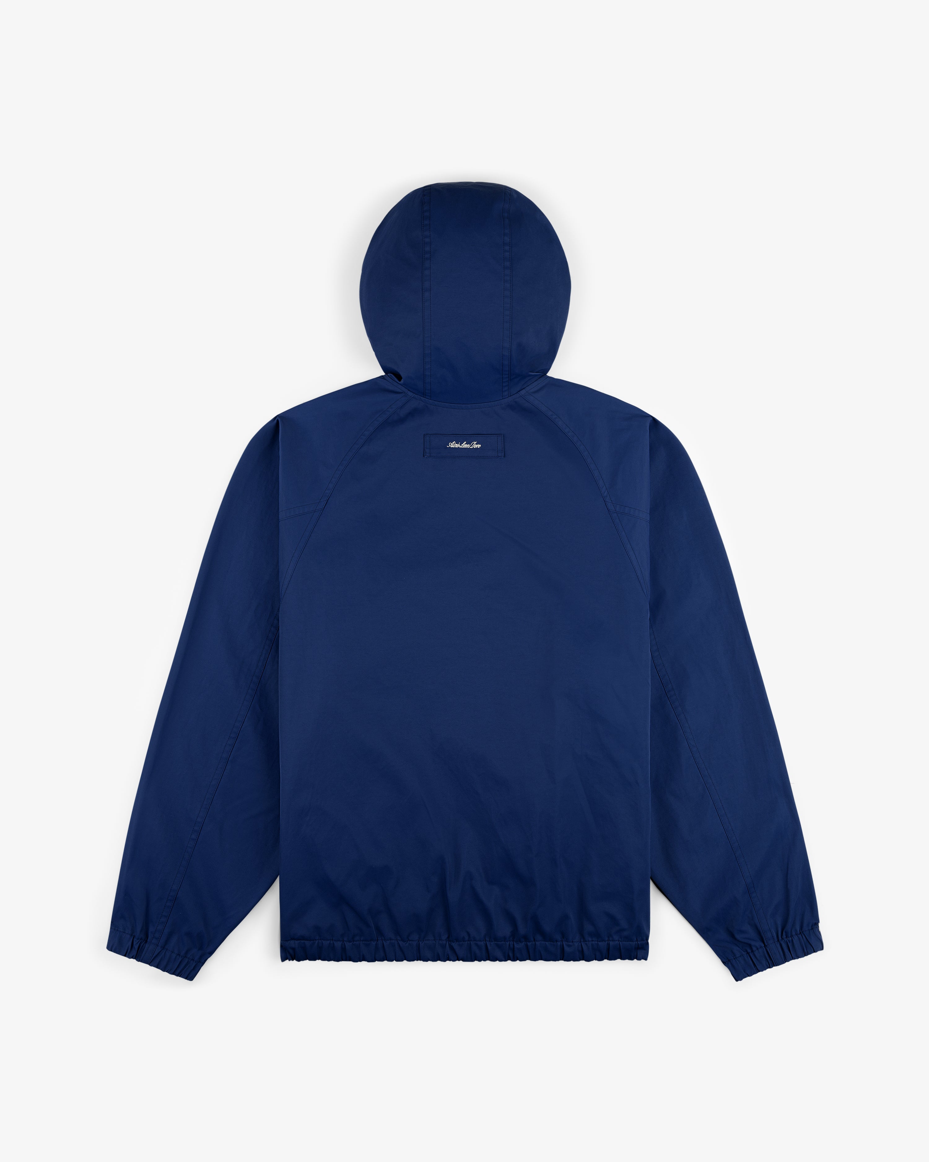Reversible Madras Windbreaker in navy blue, shown from the back with elastic cuffs and hem on a plain white background.