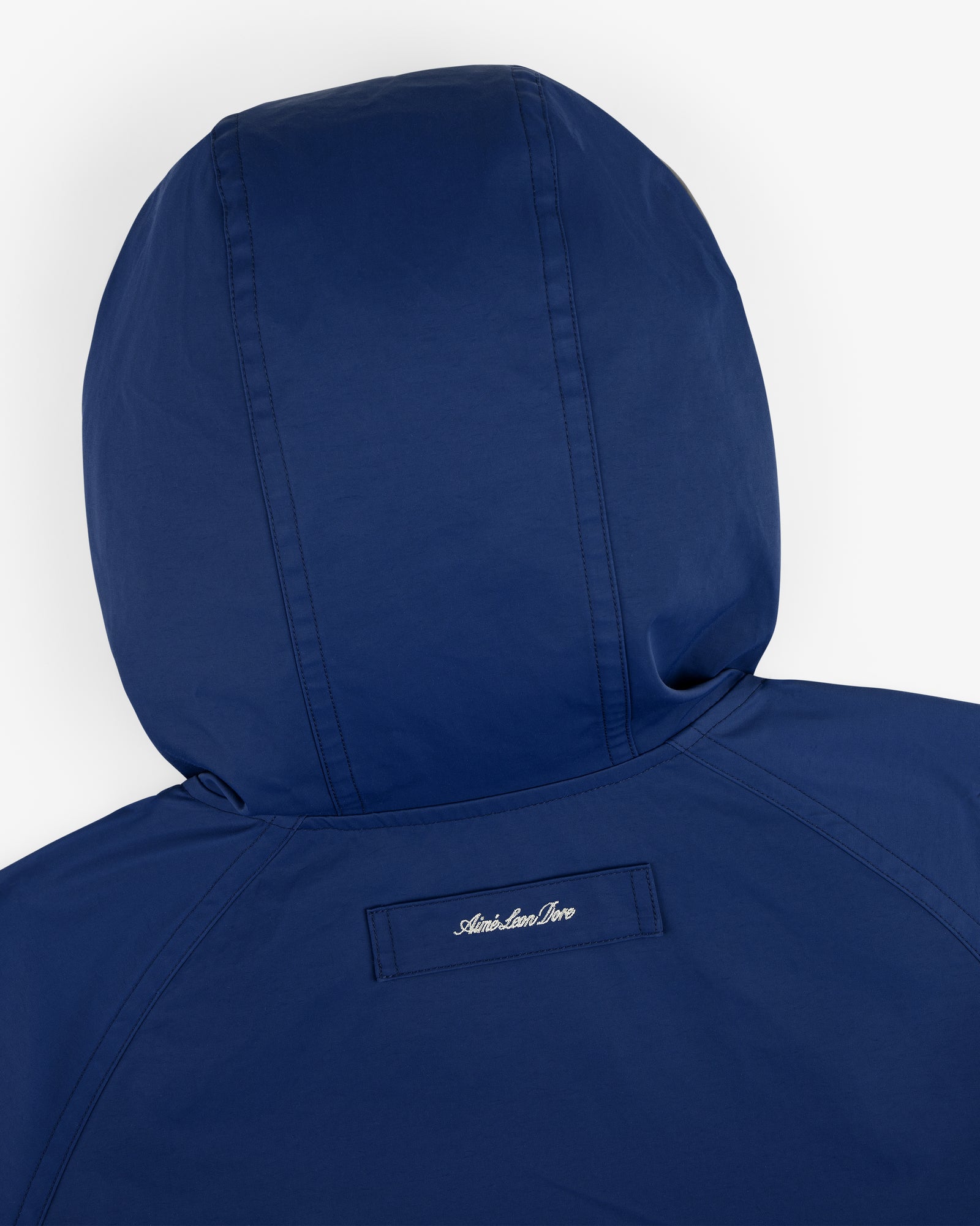 Reversible Madras Windbreaker with American River embroidered on a small patch below the back hood.