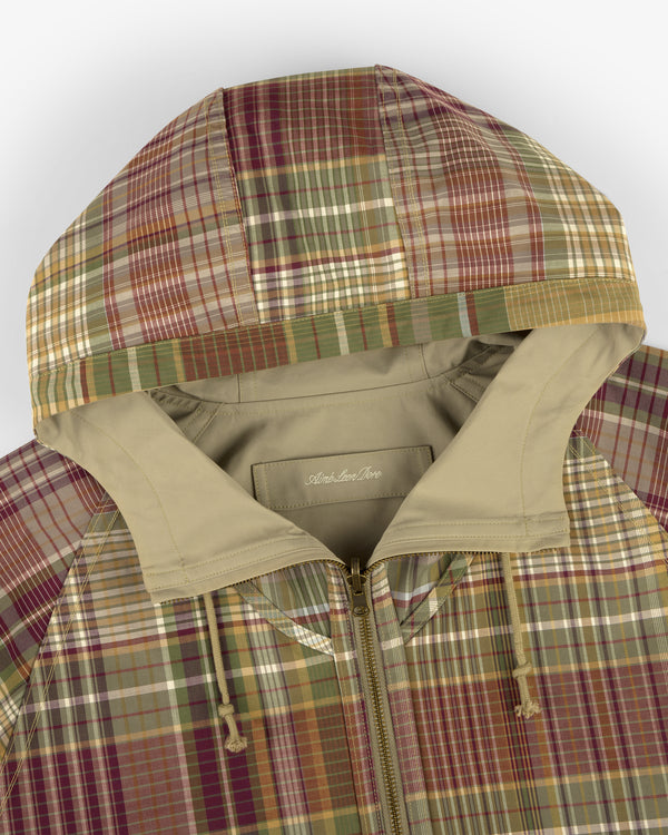 Reversible Madras Windbreaker with multicolor plaid, beige lining, zipper closure, and drawstrings.