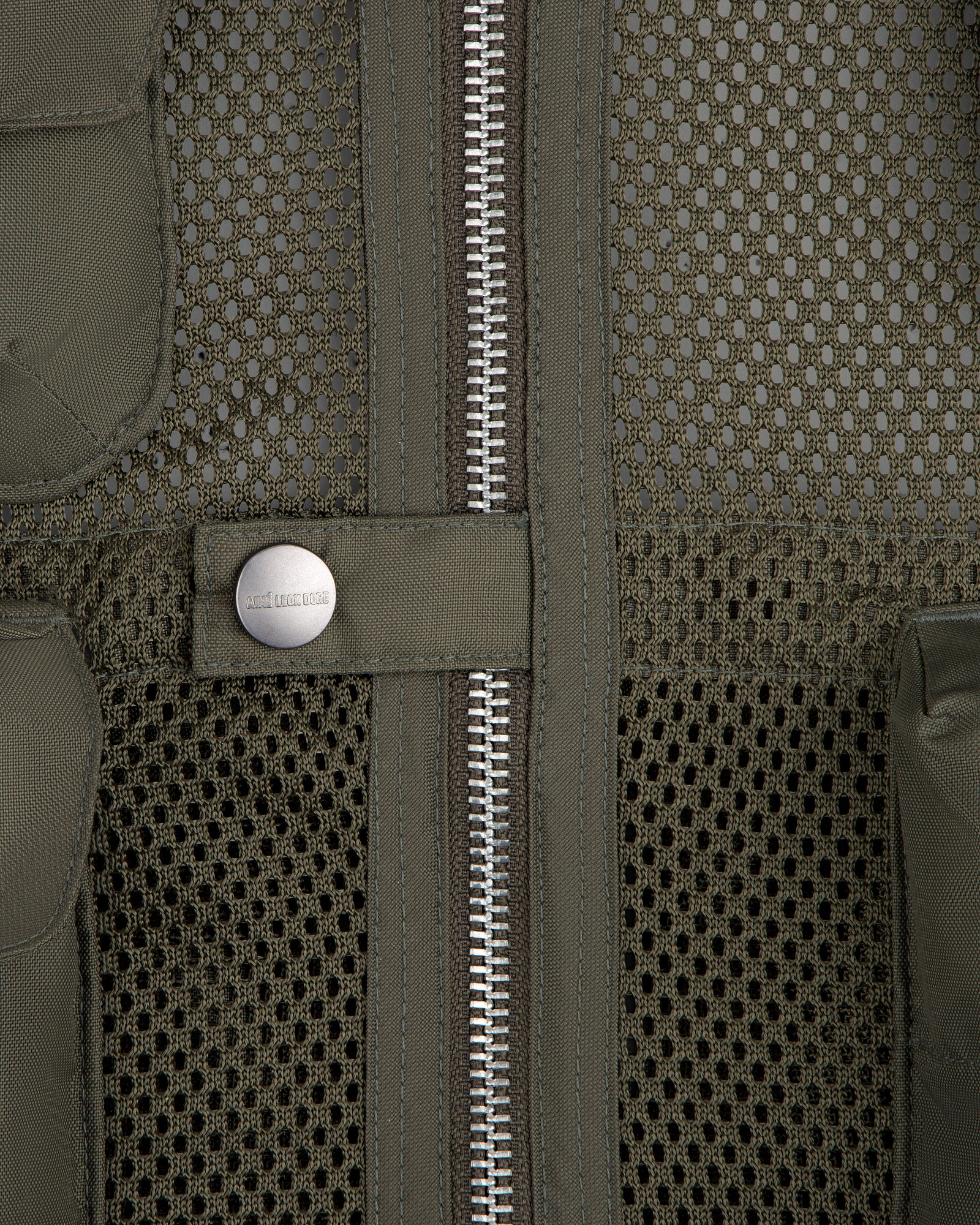 Close-up of the Nylon Utility Vest featuring mesh fabric, center zipper, snap button, and olive green color.