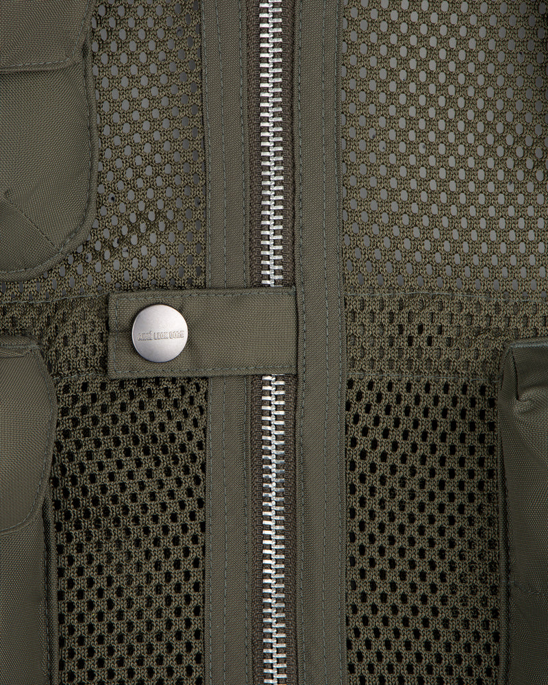 Close-up of the Nylon Utility Vest featuring mesh fabric, center zipper, snap button, and olive green color.