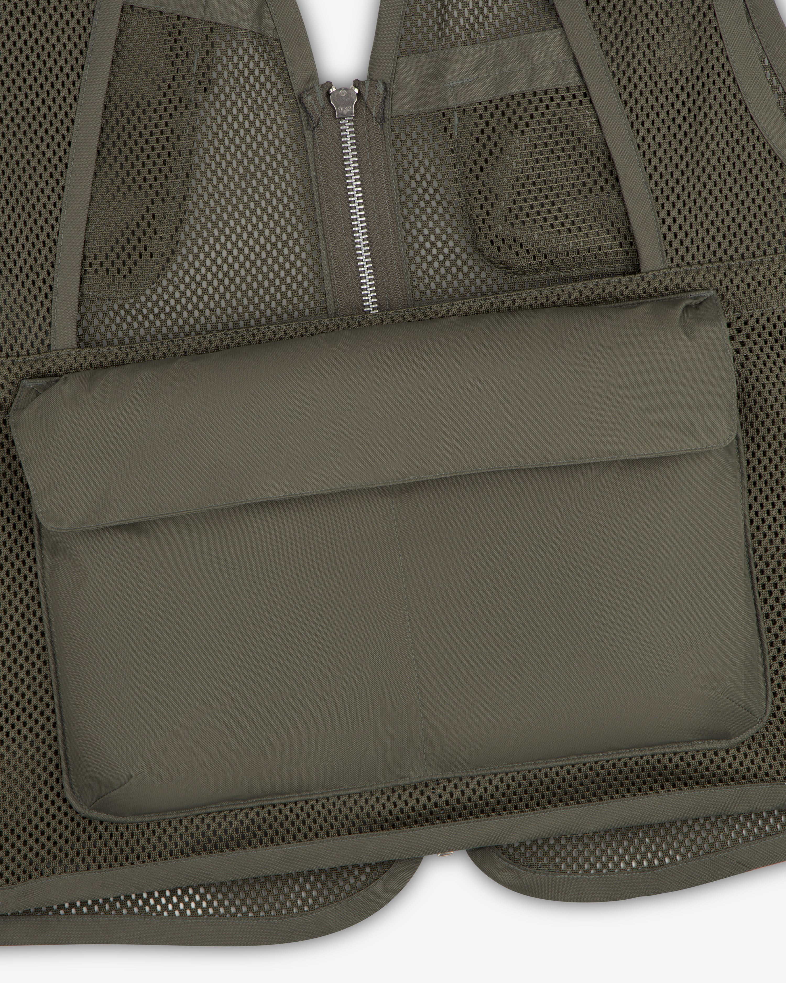 Close-up of the Nylon Utility Vest in olive green mesh with a zippered front and large padded pocket.