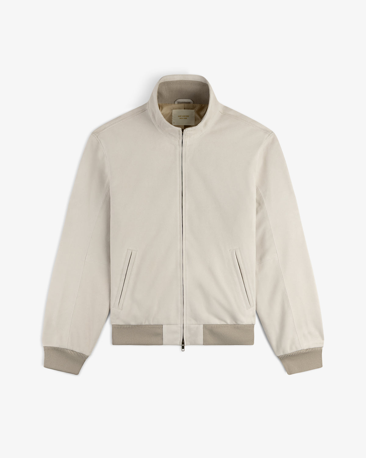 Suede Track Jacket in light beige with ribbed cuffs, hem, zip front, and two slant pockets on a white background.