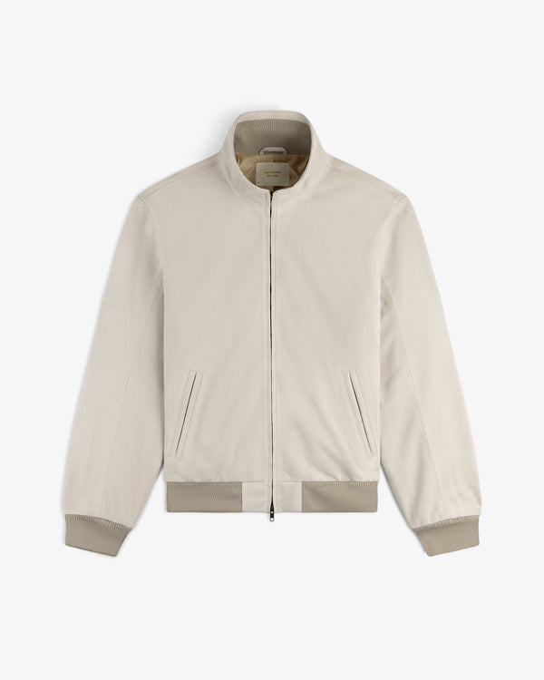 Suede Track Jacket in light beige with ribbed cuffs, hem, zip front, and two slant pockets on a white background.