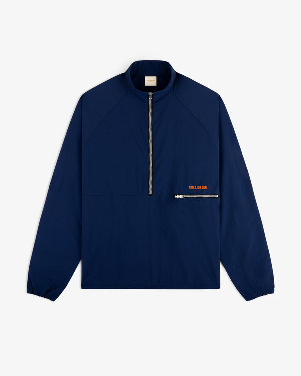 A navy Nylon Packable Windbreaker with a half-zip front, zip chest pocket, and small orange text.